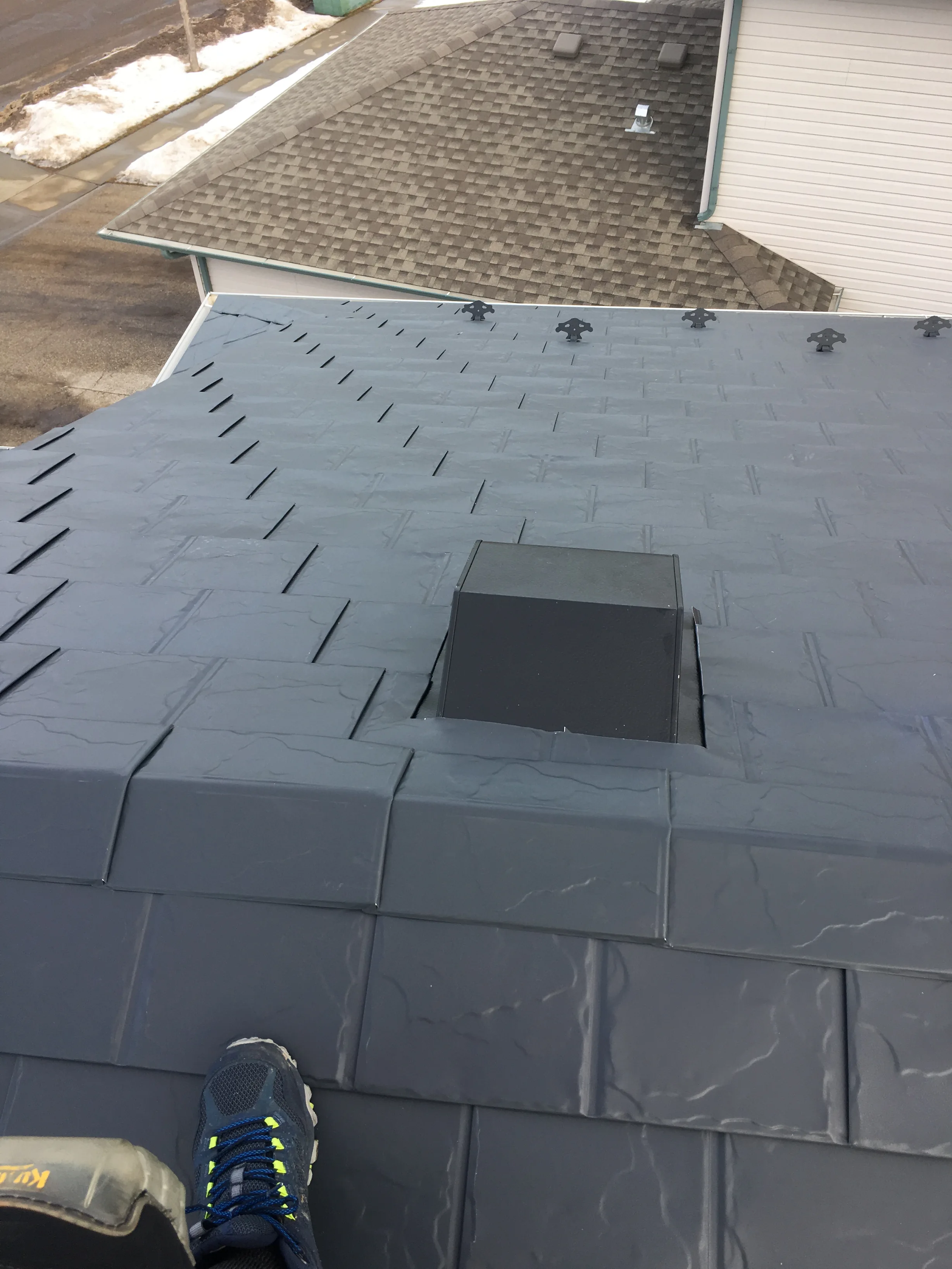 Deep Charcoal Interlock Slate aluminum roof on a large single-family home with a metal roof in Fort, Fort Saskatchewan, Alberta