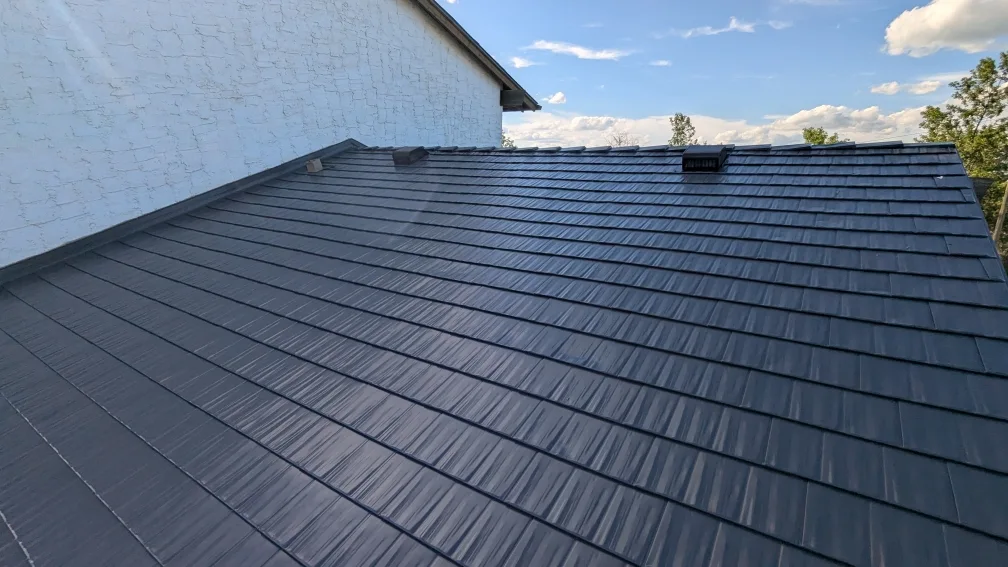 Deep Charcoal Interlock Cedar Shingle aluminum roof on a Deep Charcoal Interlock metal roof on a single-family, Castor, Alberta