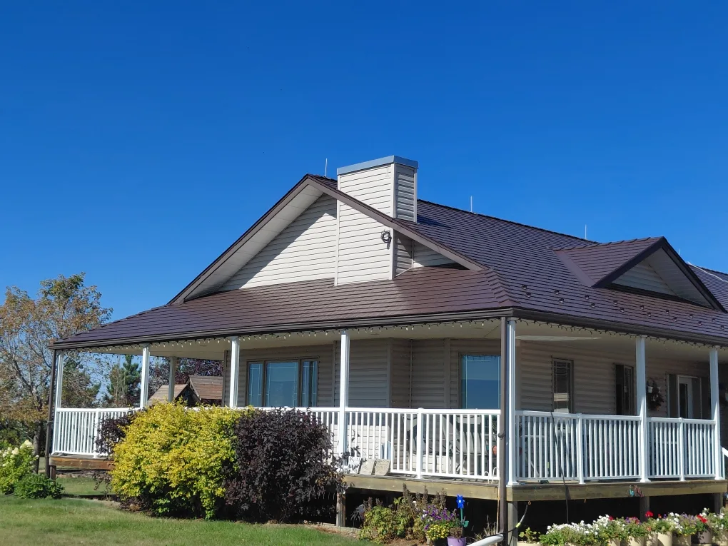 Colonial Brown Interlock Cedar Shingle aluminum roof on a Colonial brown roof on a one-storey home with a covered, Delia, Alberta