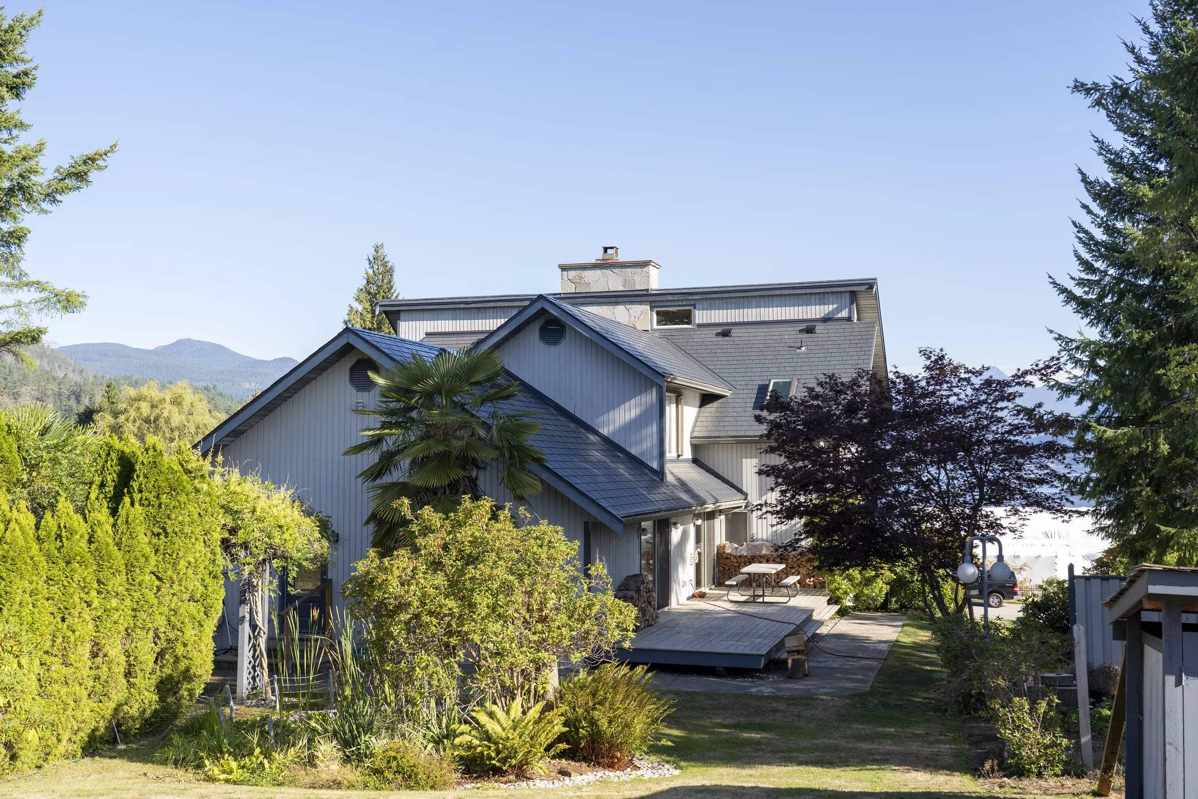 Deep Charcoal Interlock Slate aluminum roof on a modern home with a metal roof under construction in a, Sechelt, British Columbia