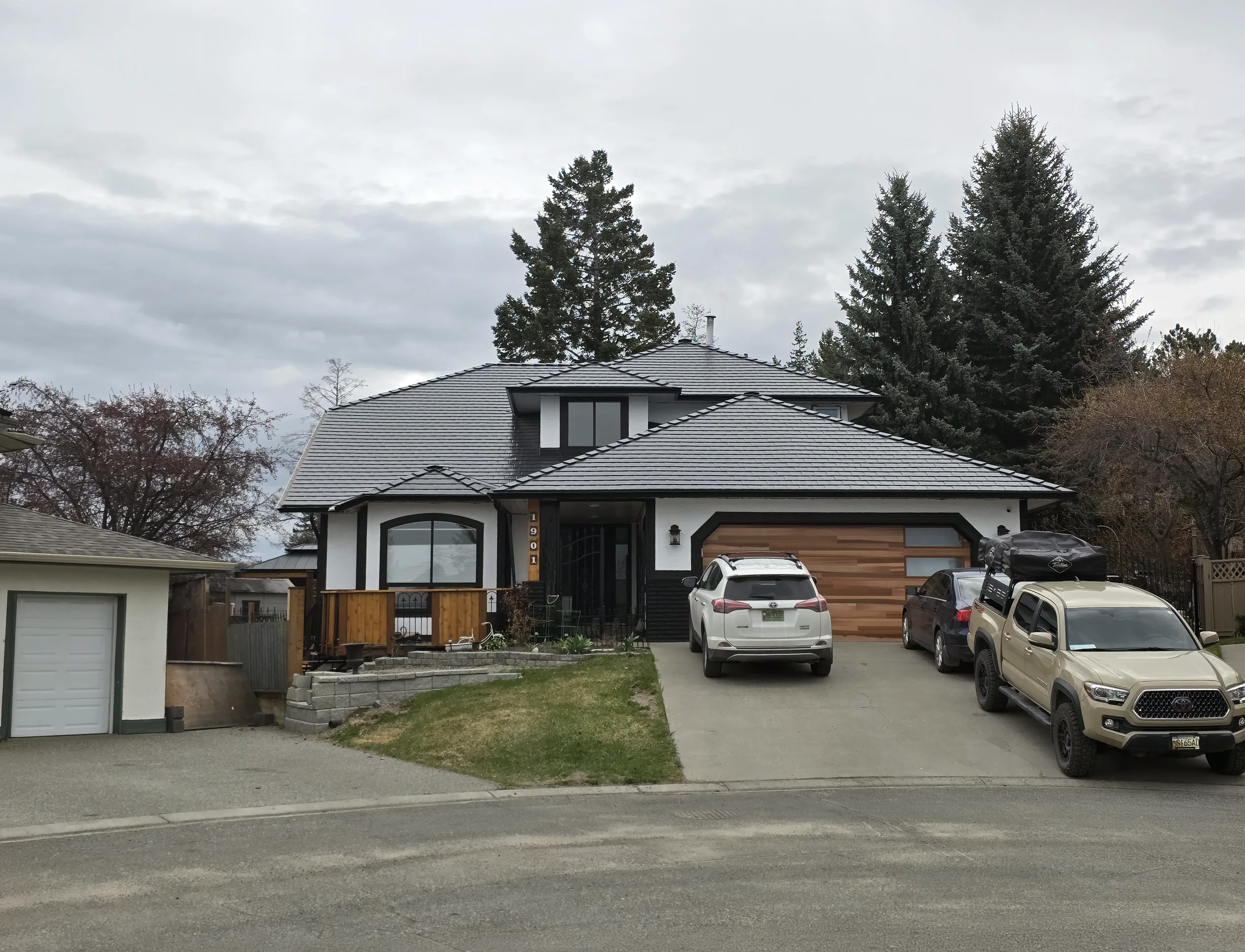Black Interlock Slate aluminum roof on a black and white modern home with a metal roof on a rural, Kamloops, British Columbia