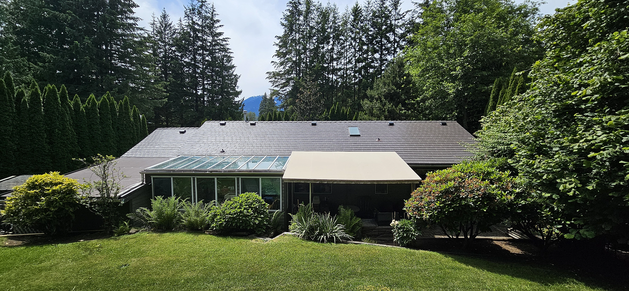 Interlock Aluminum Slate Metal Roofing – Tudor Brown | Squamish, BC (Rear elevation)