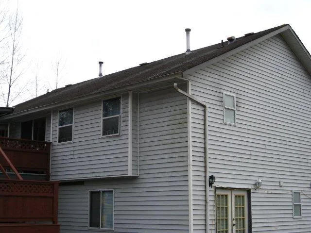 Before: a rotten asphalt shingle roof on the home, Mission, British Columbia, ahead of a Charcoal Grey Interlock Slate aluminum roof