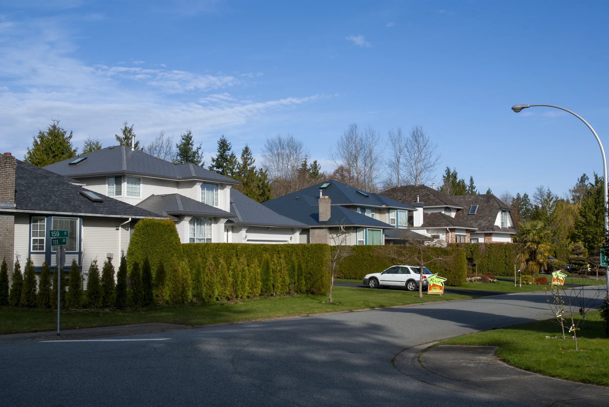 Musket Grey Interlock Slate aluminum roof on a two-storey home with a metal roof in Musket Grey among, Surrey, British Columbia