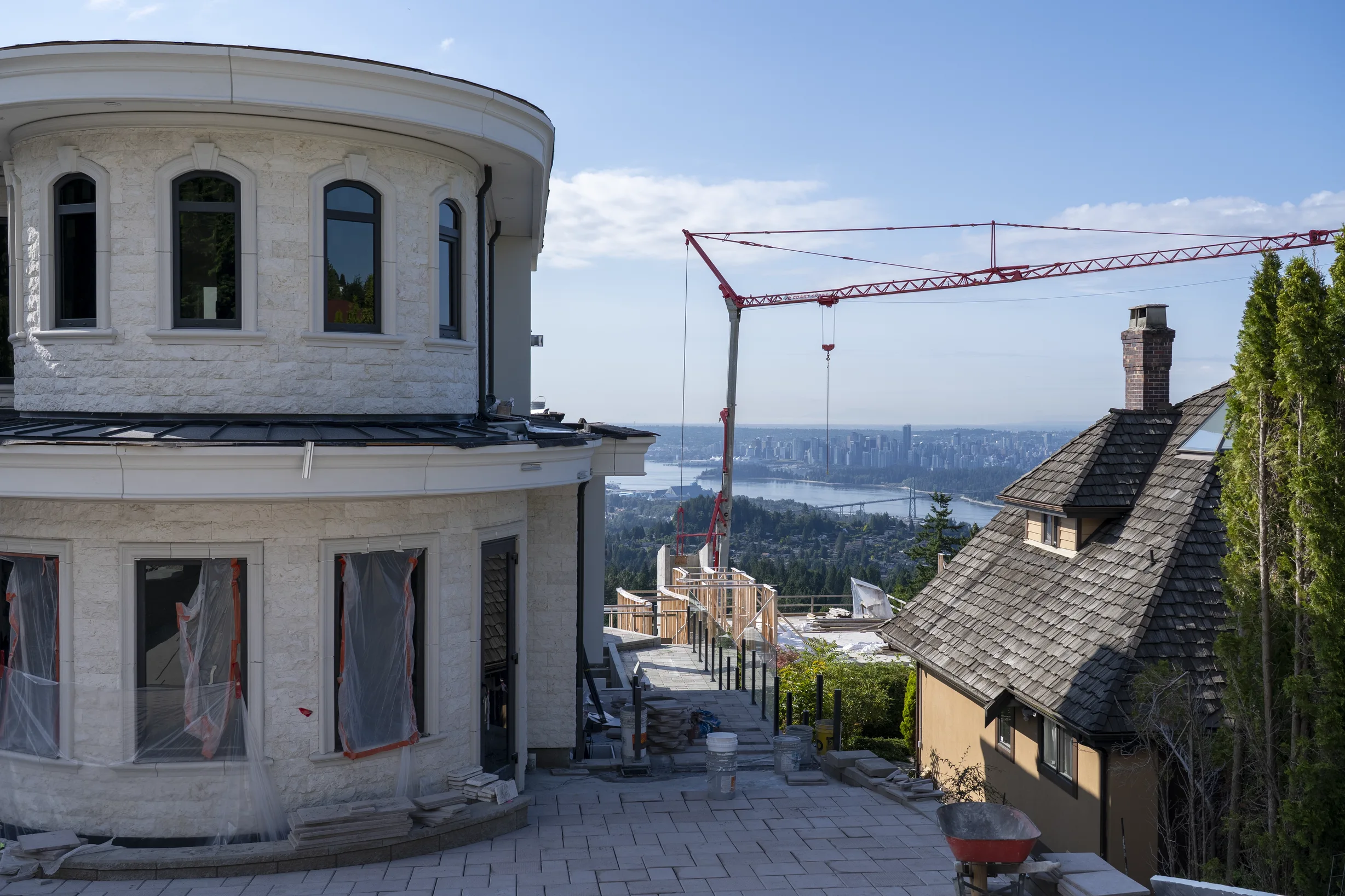 Deep Charcoal Interlock Slate aluminum roof being installed on the home, replacing new construction, West Vancouver, British Columbia