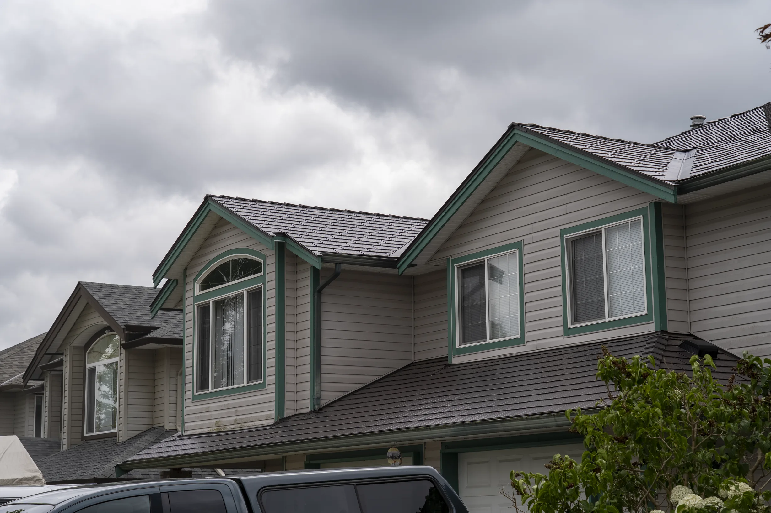 Tudor Brown Interlock Cedar Shingle aluminum roof on a Tudor home with a metal roof in Tudor Brown colour in an, Maple Ridge, British Columbia