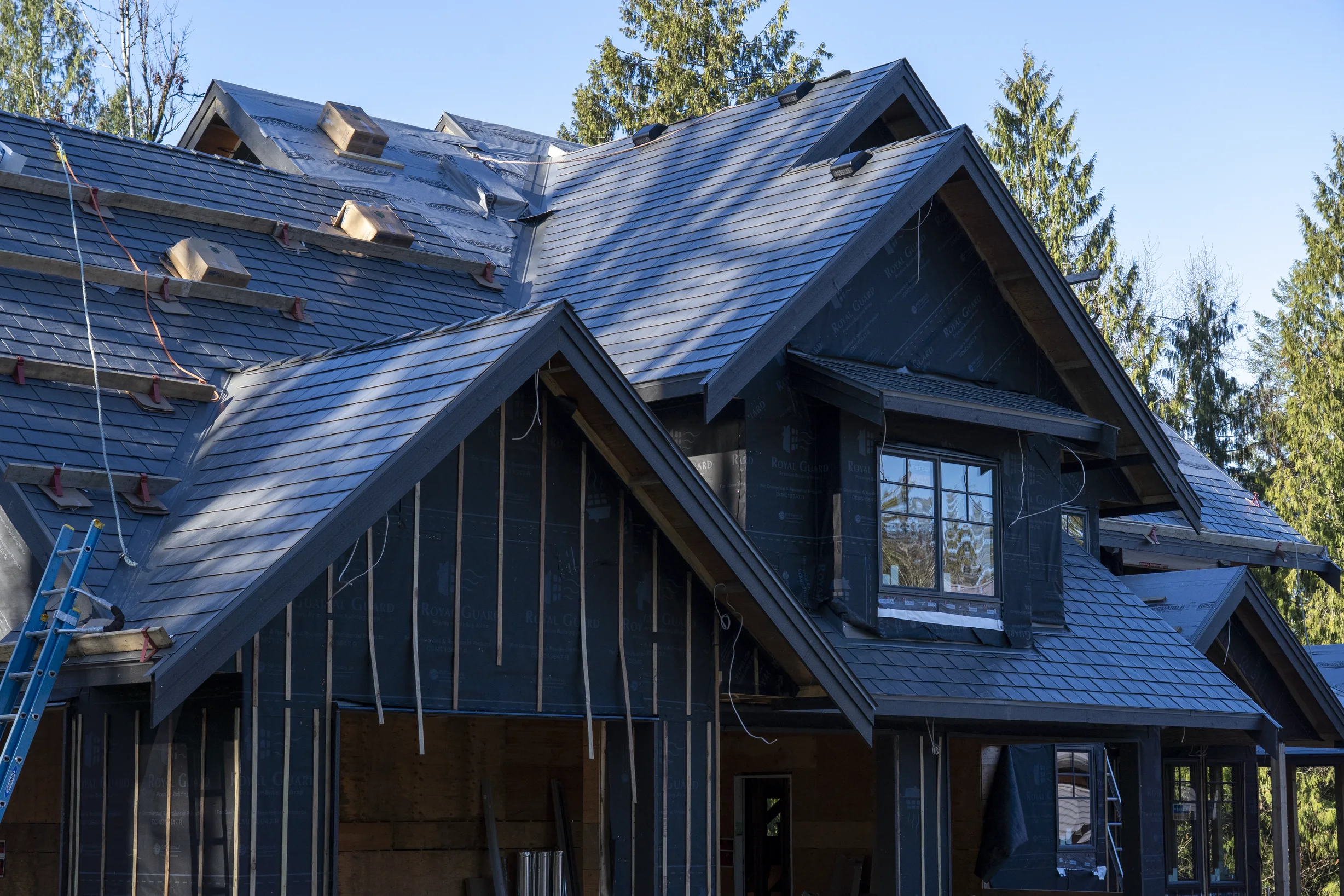 Musket Grey Interlock Slate aluminum roof being installed on the home, replacing a worn out asphalt shingle roof, Abbotsford, British Columbia