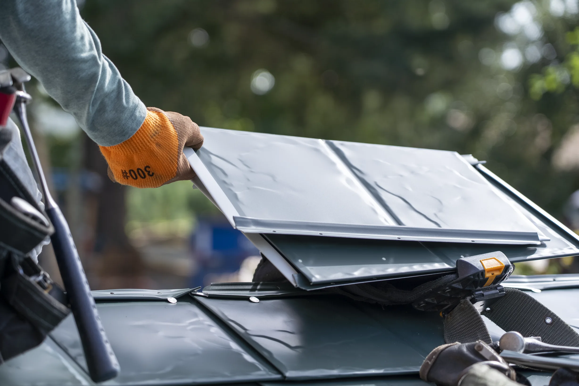 Hunter Green Interlock Slate aluminum roof being installed on a house with an Interlock metal roof under construction in, Langley, British Columbia