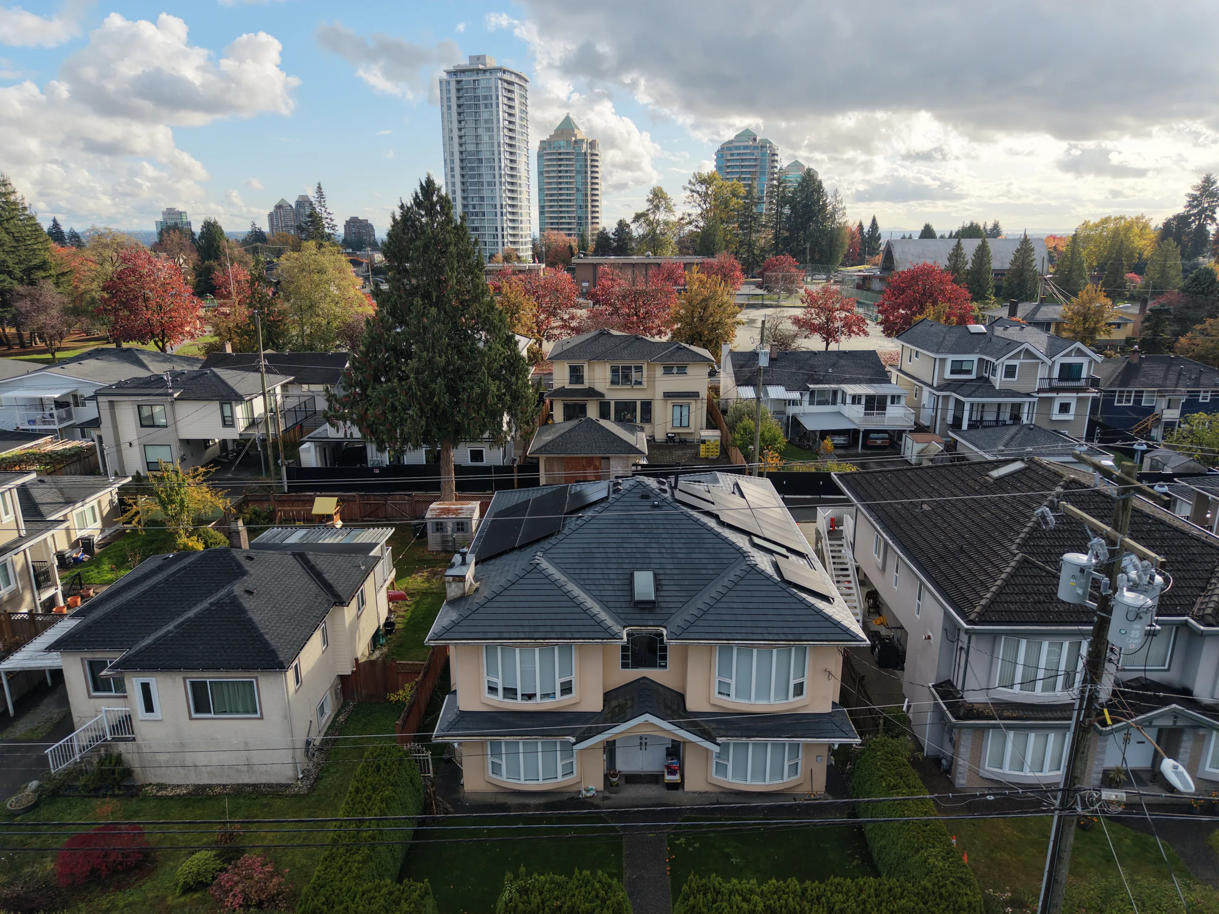 Deep Charcoal Interlock Slate aluminum roof on a two-storey home with dormers in a residential, Burnaby, British Columbia