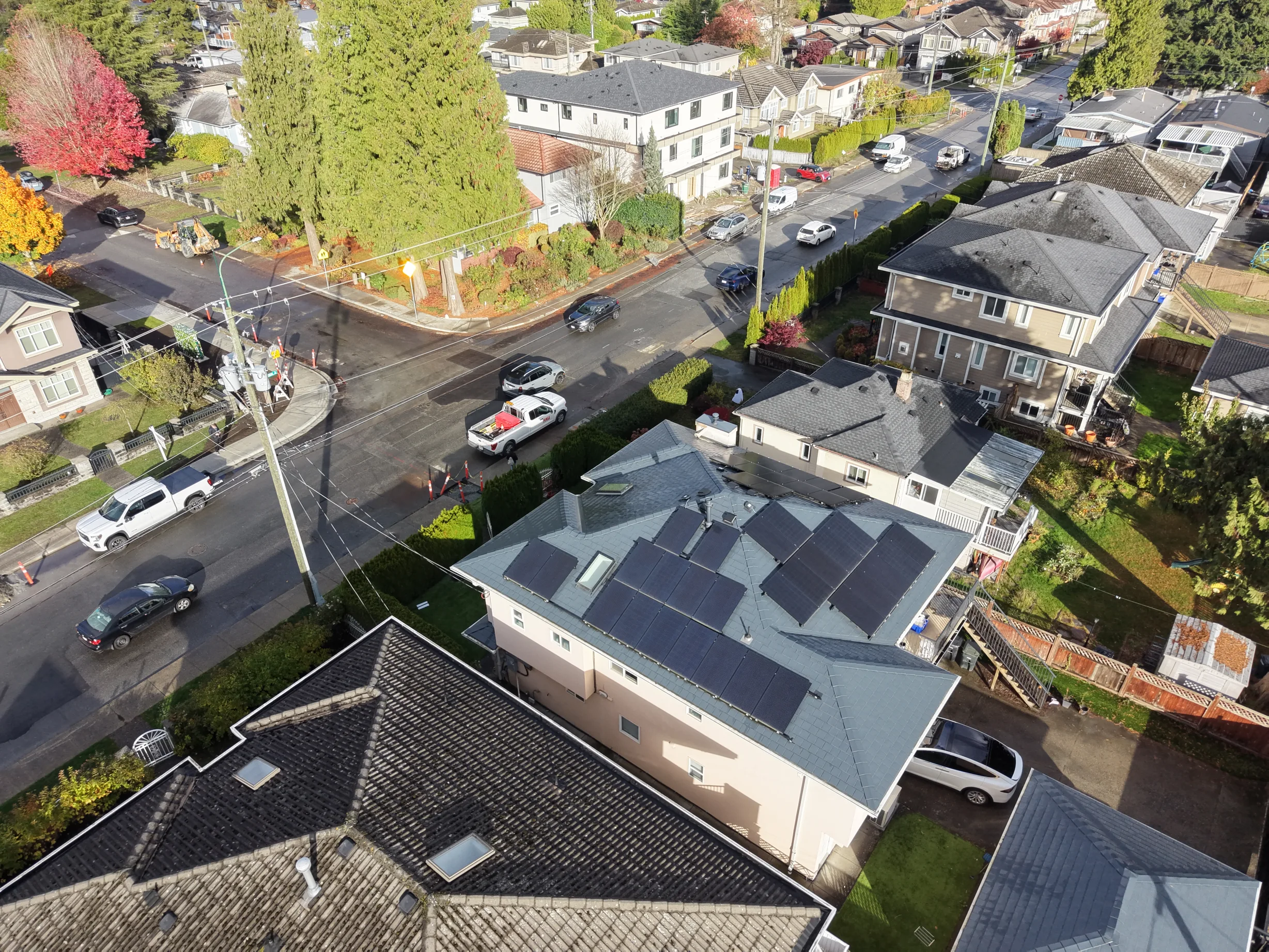 Deep Charcoal Interlock Slate aluminum roof on a two-storey ranch home with dormers in a forested urban, Burnaby, British Columbia