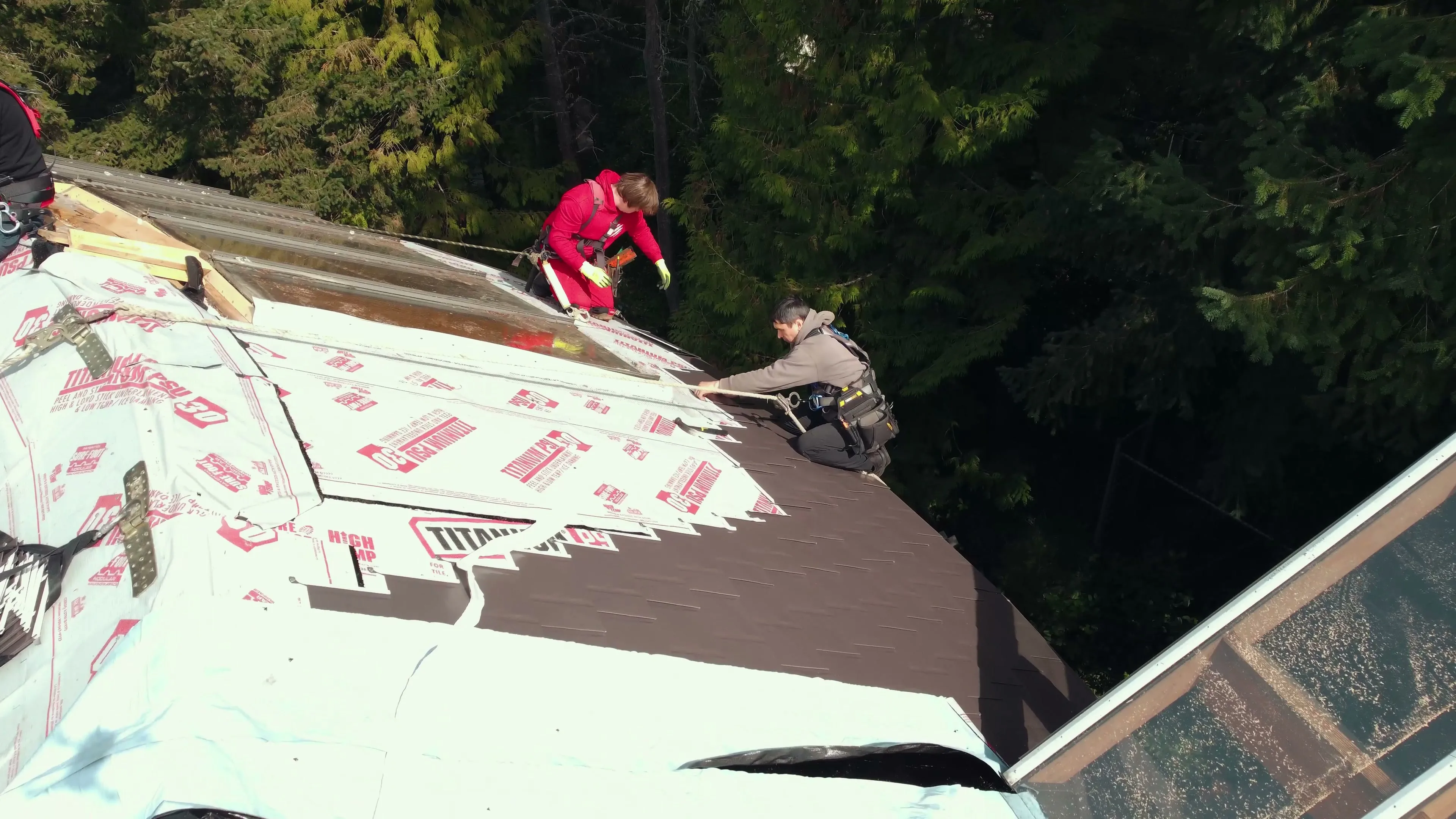 Interlock aluminum Tudor Brown slate metal roof on a West Vancouver, BC home, backed by a transferable 50-year warranty.