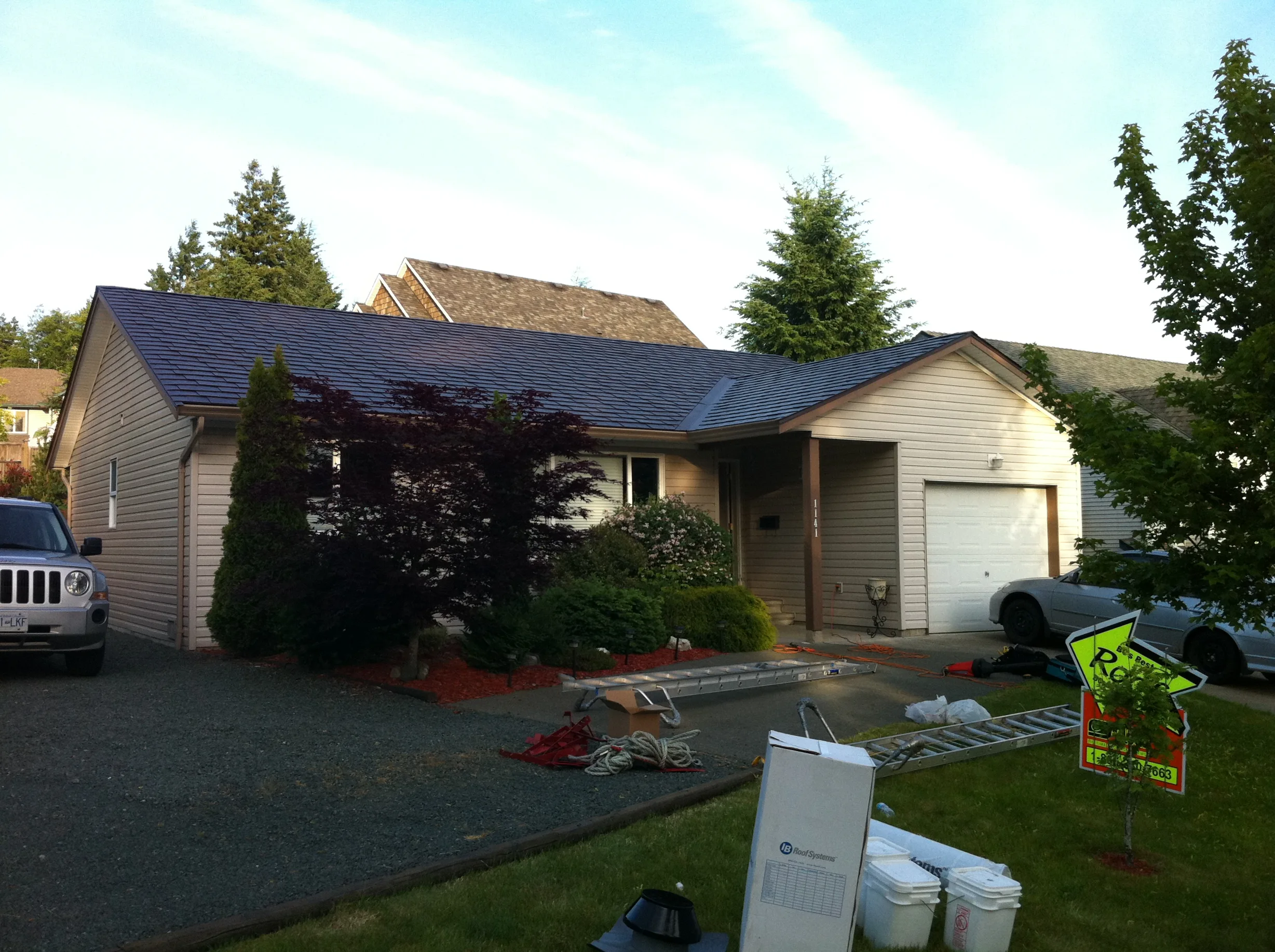 Colonial Brown Interlock Slate aluminum roof on a colonial brown metal roof on a single-family home in, Campbell River, British Columbia