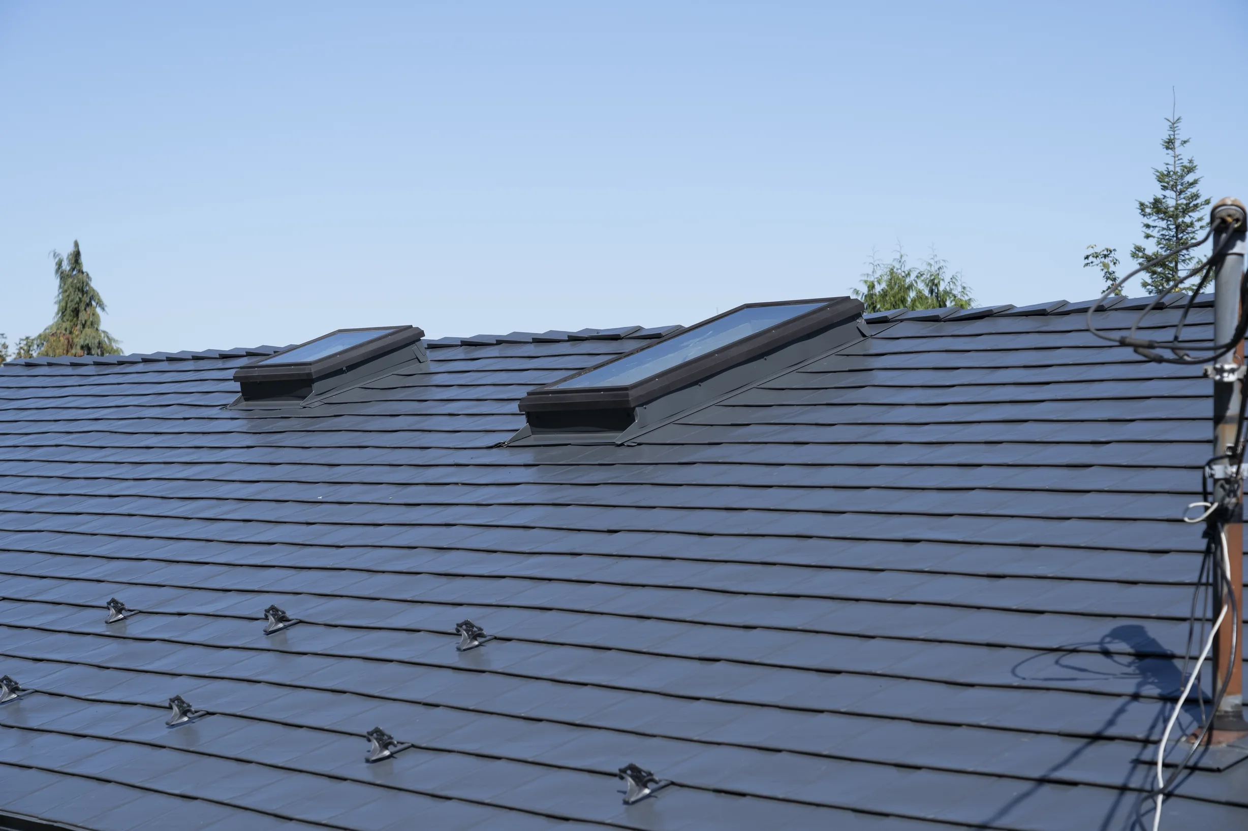 Deep Charcoal Interlock Slate aluminum roof on a deep charcoal roof on a house in Ladysmith, BC, Ladysmith, British Columbia