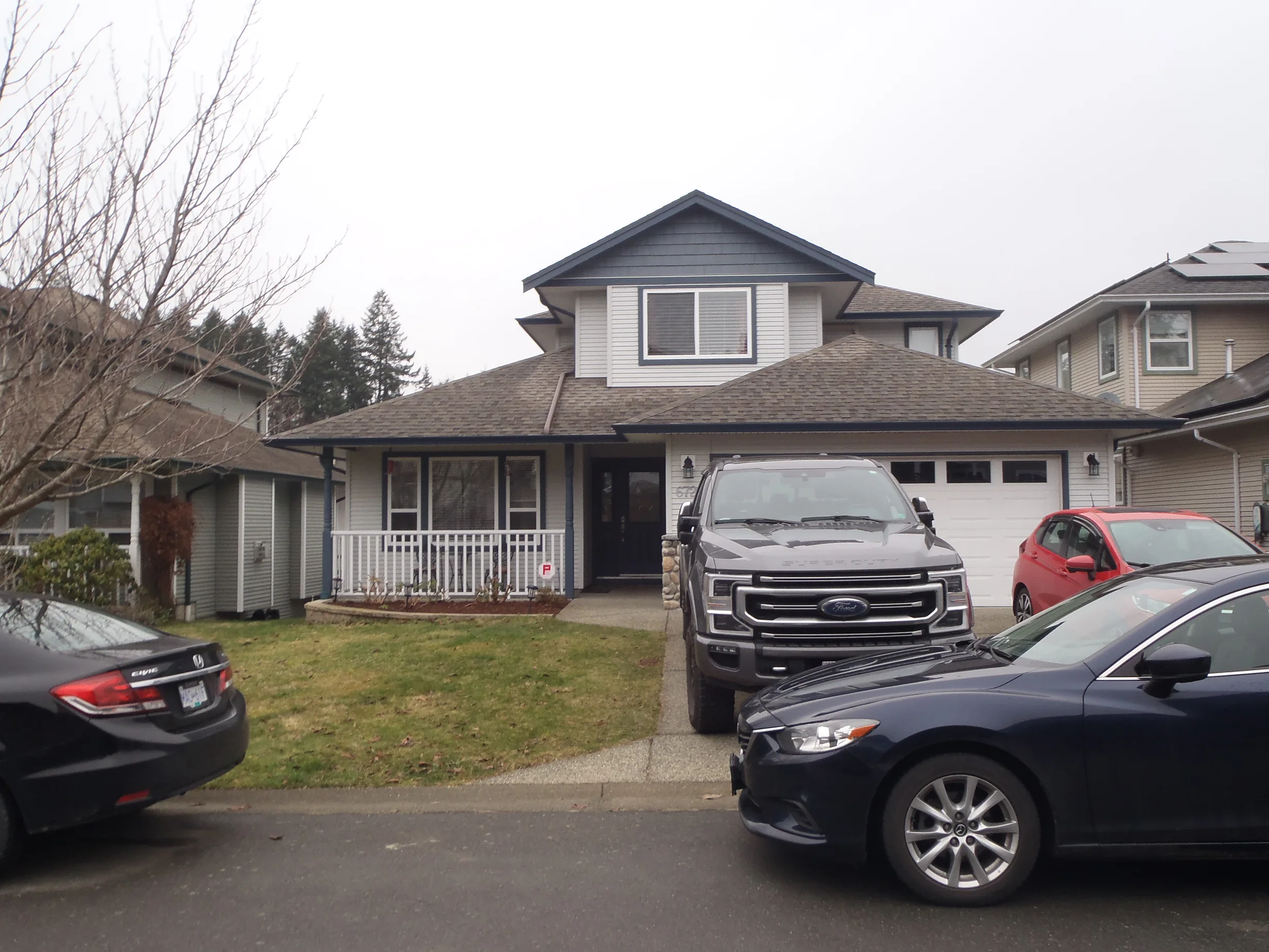 Before: a leaking asphalt shingle roof on the home, Sooke, British Columbia, ahead of a Black Interlock Slate aluminum roof