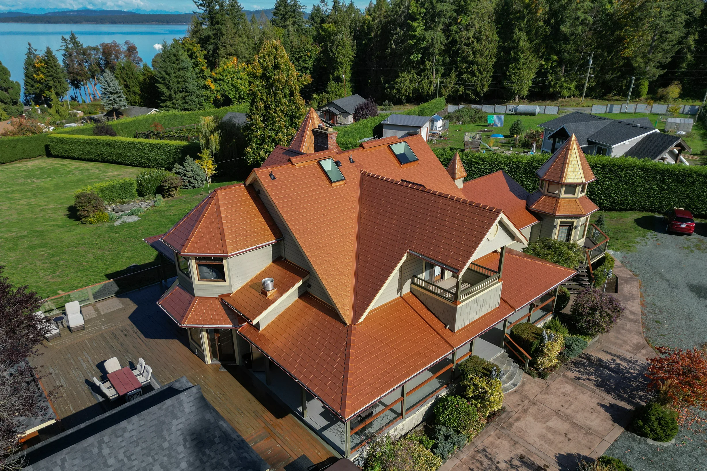 Copper Penny Interlock Slate aluminum roof on a copper penny metal roof on a two-storey Victorian home by, Ladysmith, British Columbia