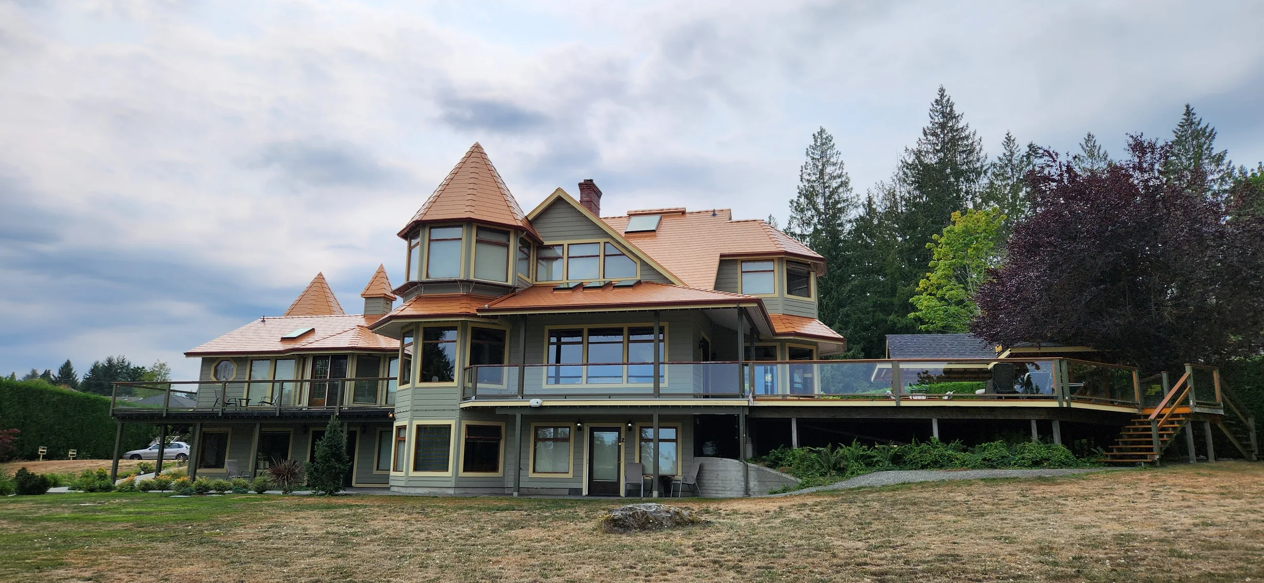 Copper Penny Interlock Slate aluminum roof on a large house with copper metal roof in a forested rural, Ladysmith, British Columbia
