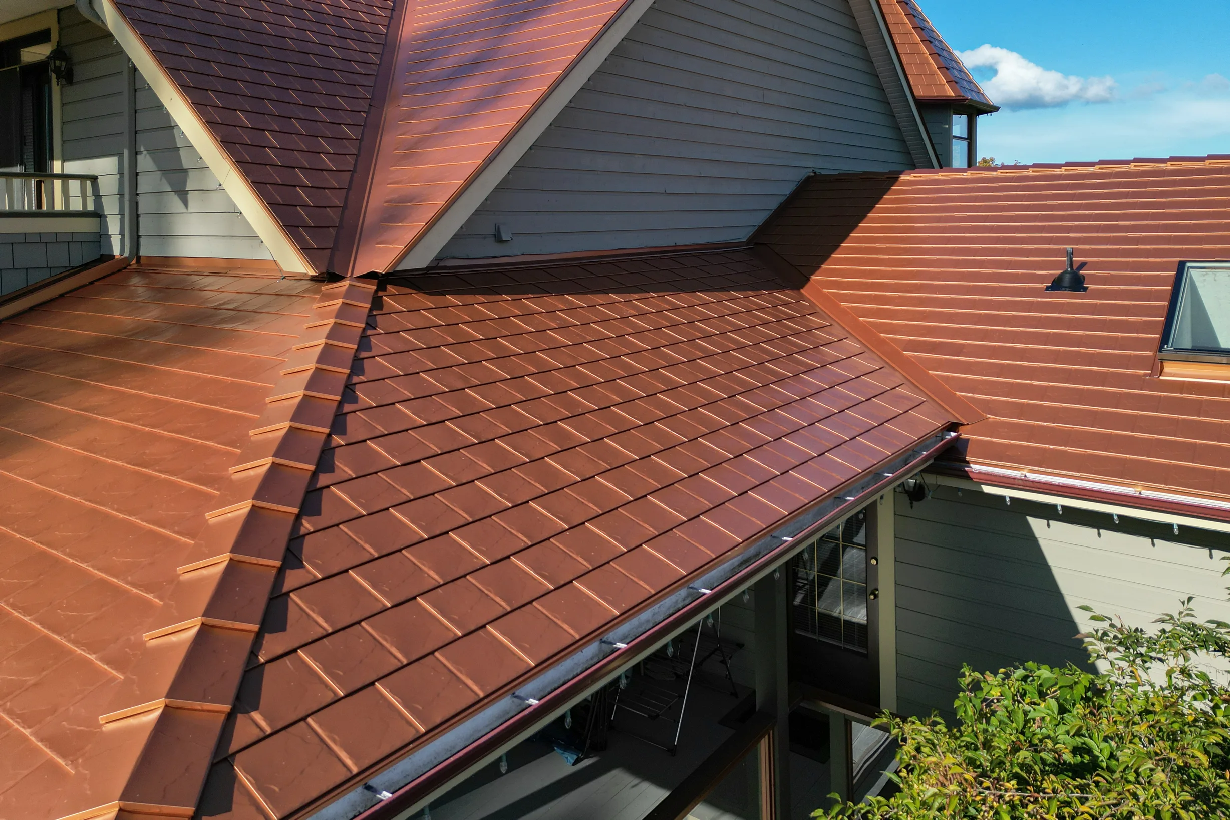 Copper Penny Interlock Slate aluminum roof on a single-family modern home with copper penny metal roof in, Ladysmith, British Columbia