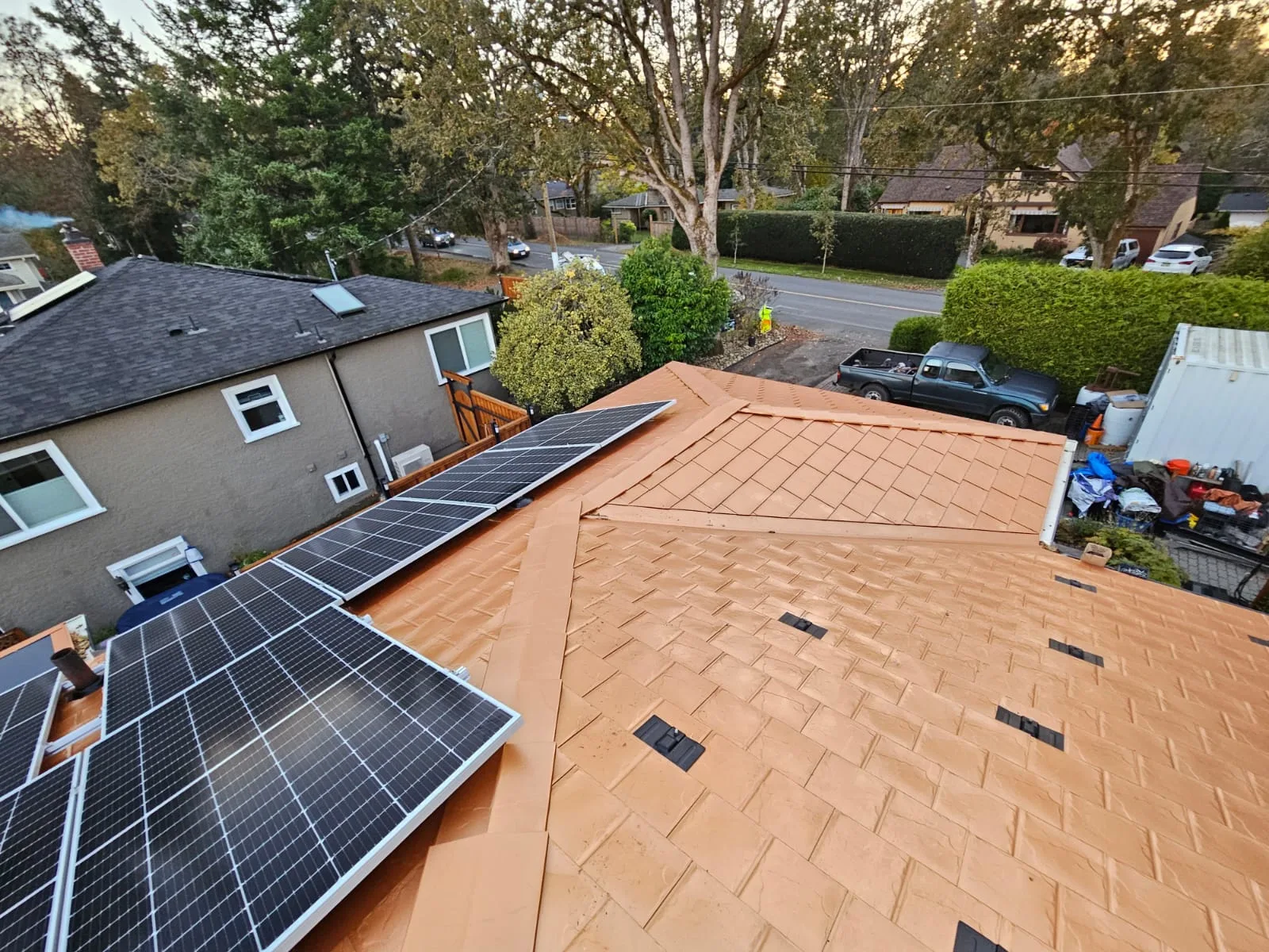 Copper Penny Interlock Slate aluminum roof on a two-storey home with copper penny metal roof in a, Victoria, British Columbia