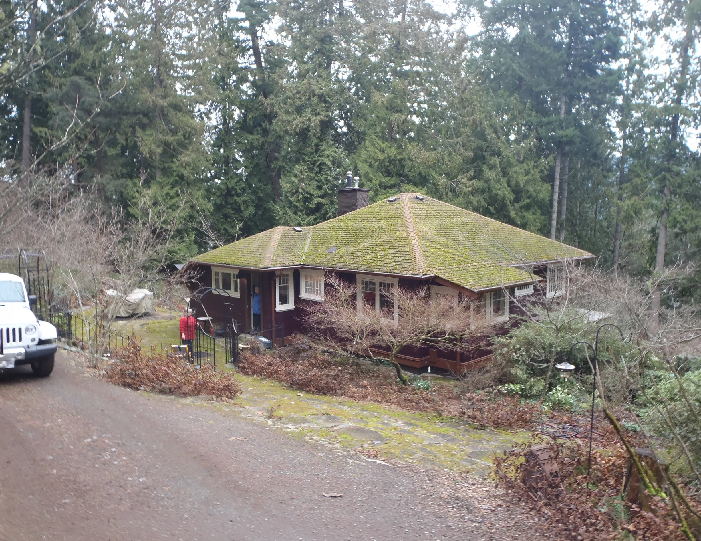 Before: a leaking asphalt shingle roof on the home, Cowichan Bay, British Columbia, ahead of a Copper Penny Interlock Slate aluminum roof