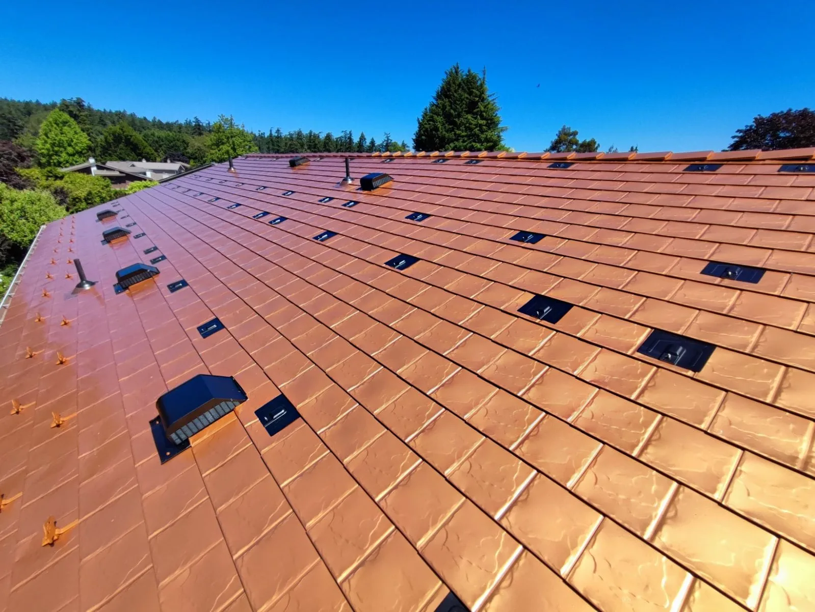 Copper Penny Interlock Slate aluminum roof on a copper penny Interlock Slate metal roof on a two-storey, Victoria, British Columbia