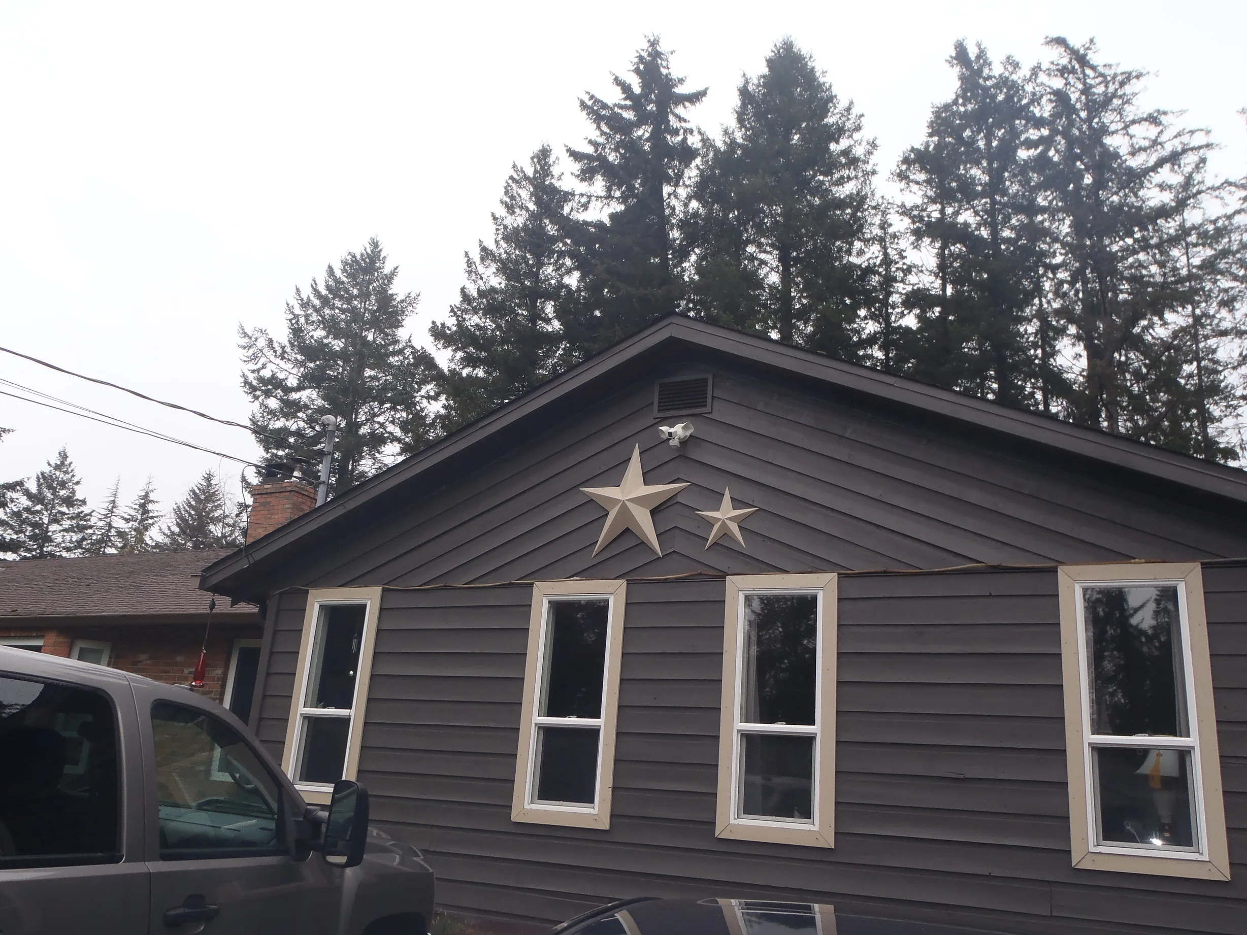 Before: a leaking asphalt shingle roof on the home, Comox, British Columbia, ahead of a Black Interlock Slate aluminum roof