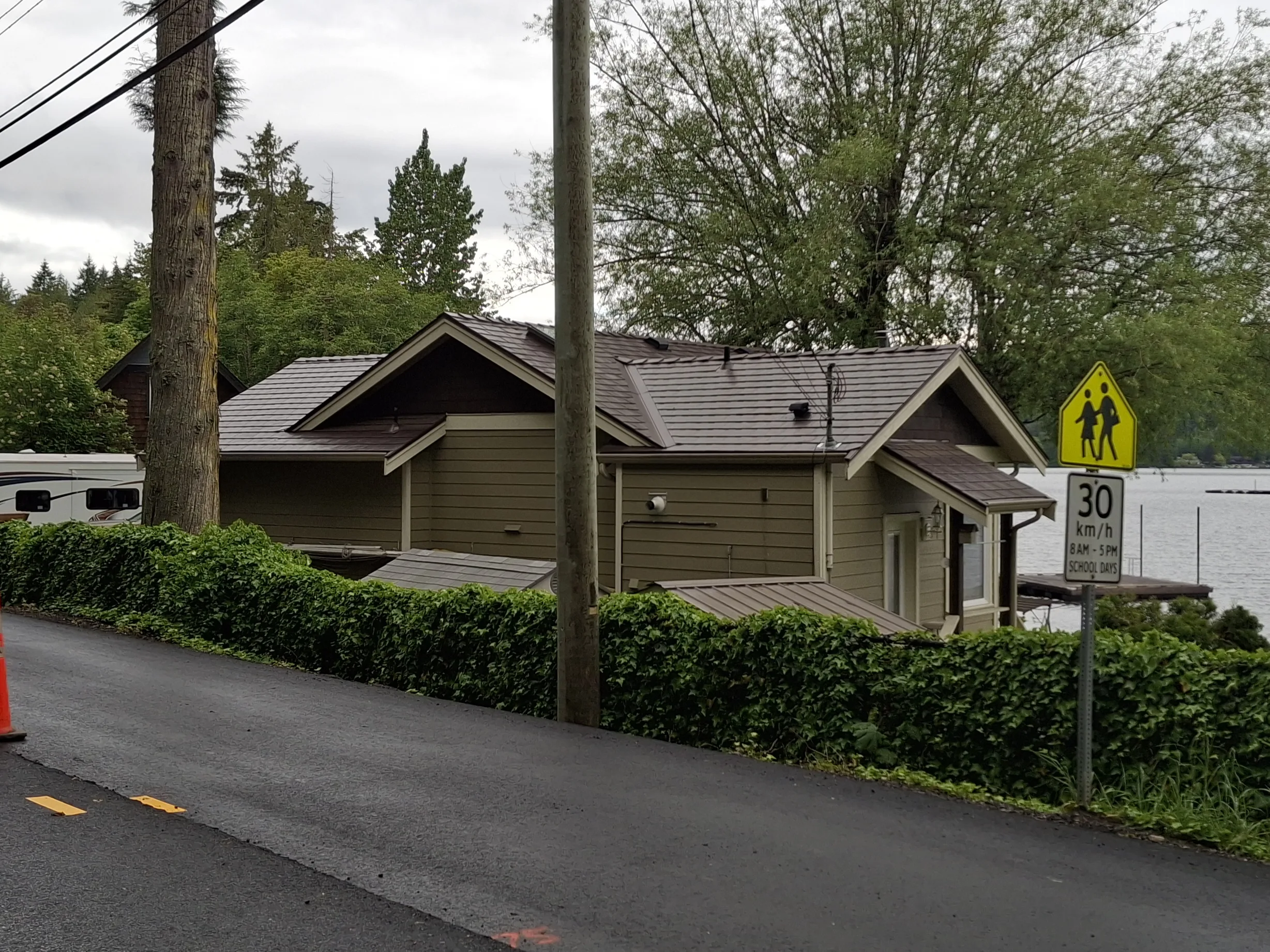 Colonial Brown Interlock Slate aluminum roof on a brown single-family home with Colonial style and a, Shawnigan Lake, British Columbia