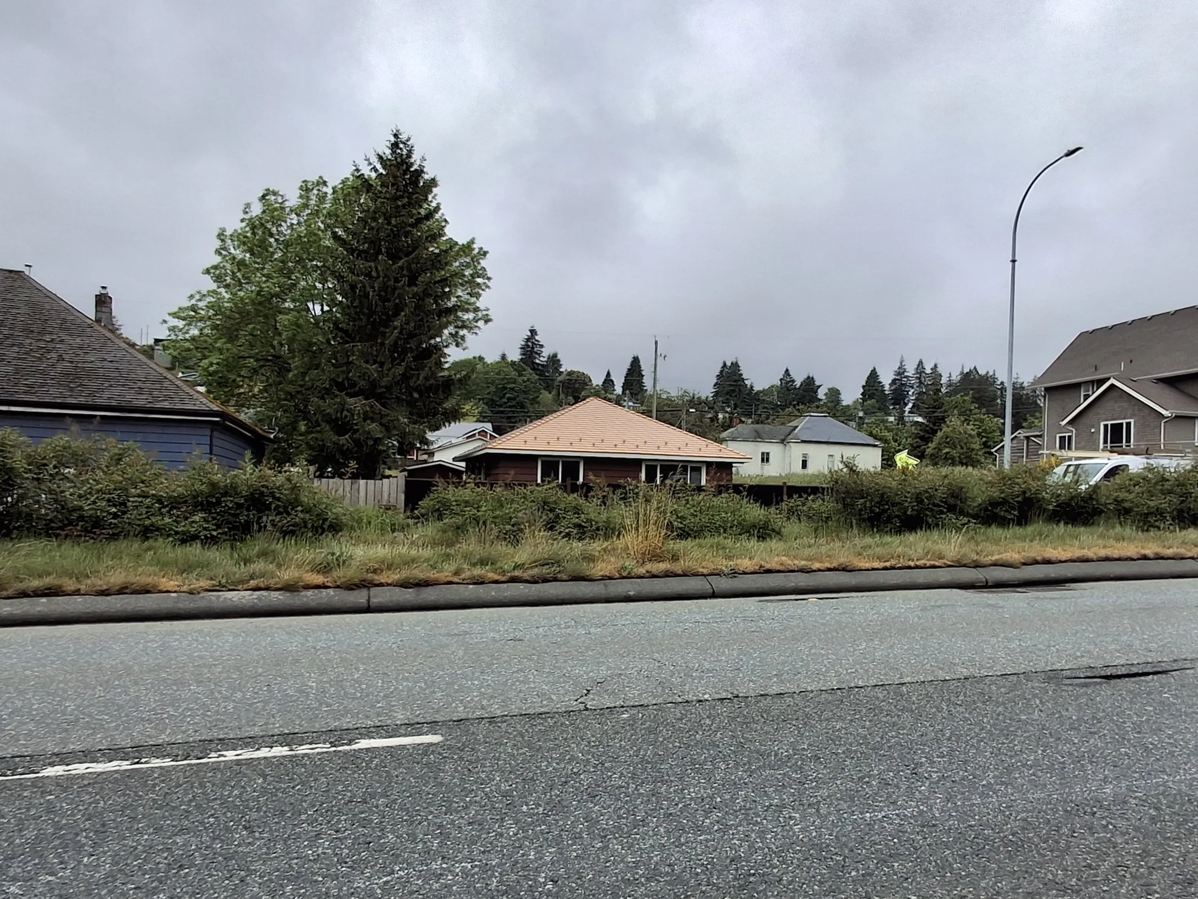 Copper Penny Interlock Slate aluminum roof on a house with a copper penny metal roof in a rural setting, Ladysmith, British Columbia