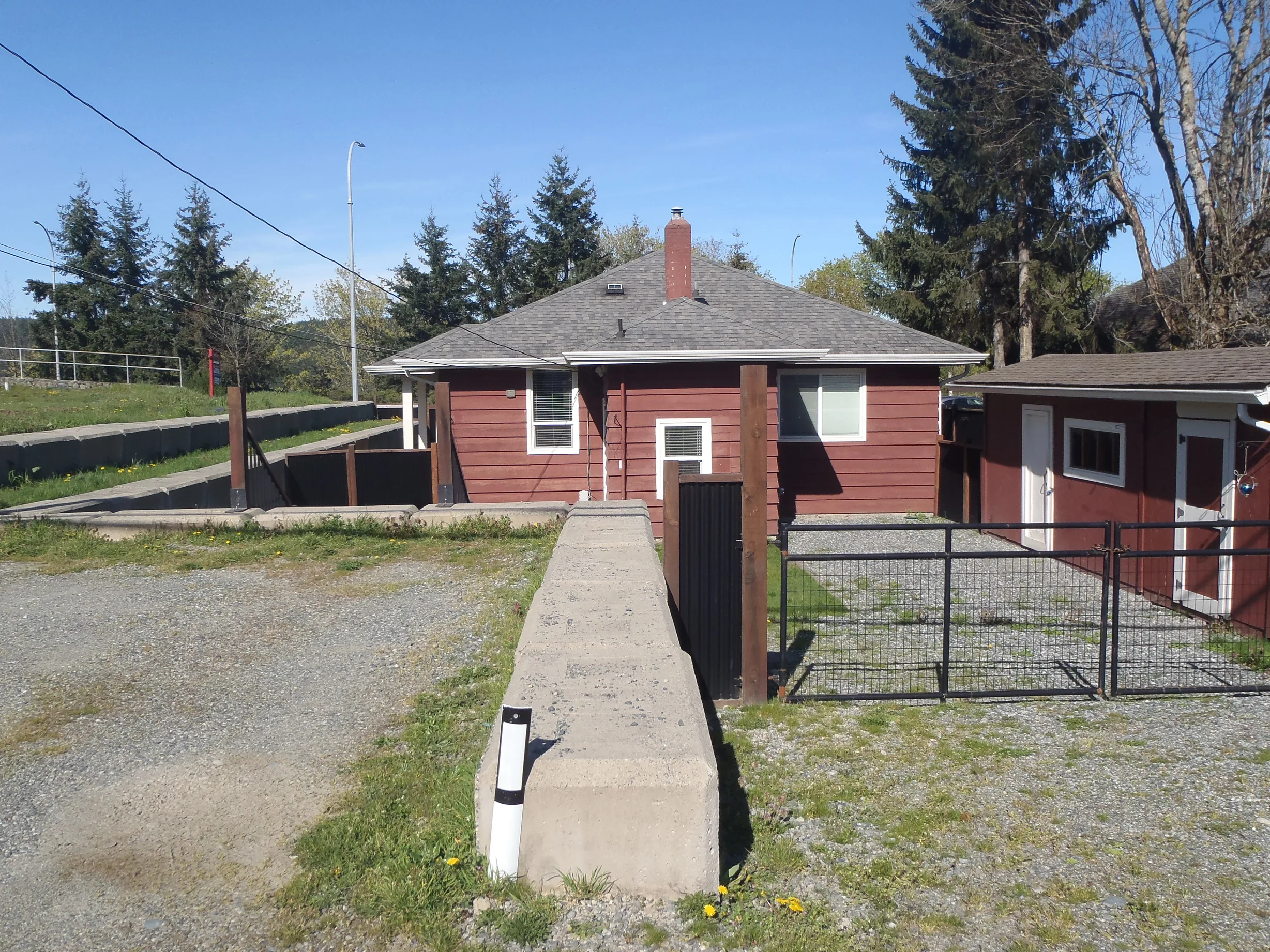 Before: a leaking asphalt shingle roof on the home, Ladysmith, British Columbia, ahead of a Copper Penny Interlock Slate aluminum roof