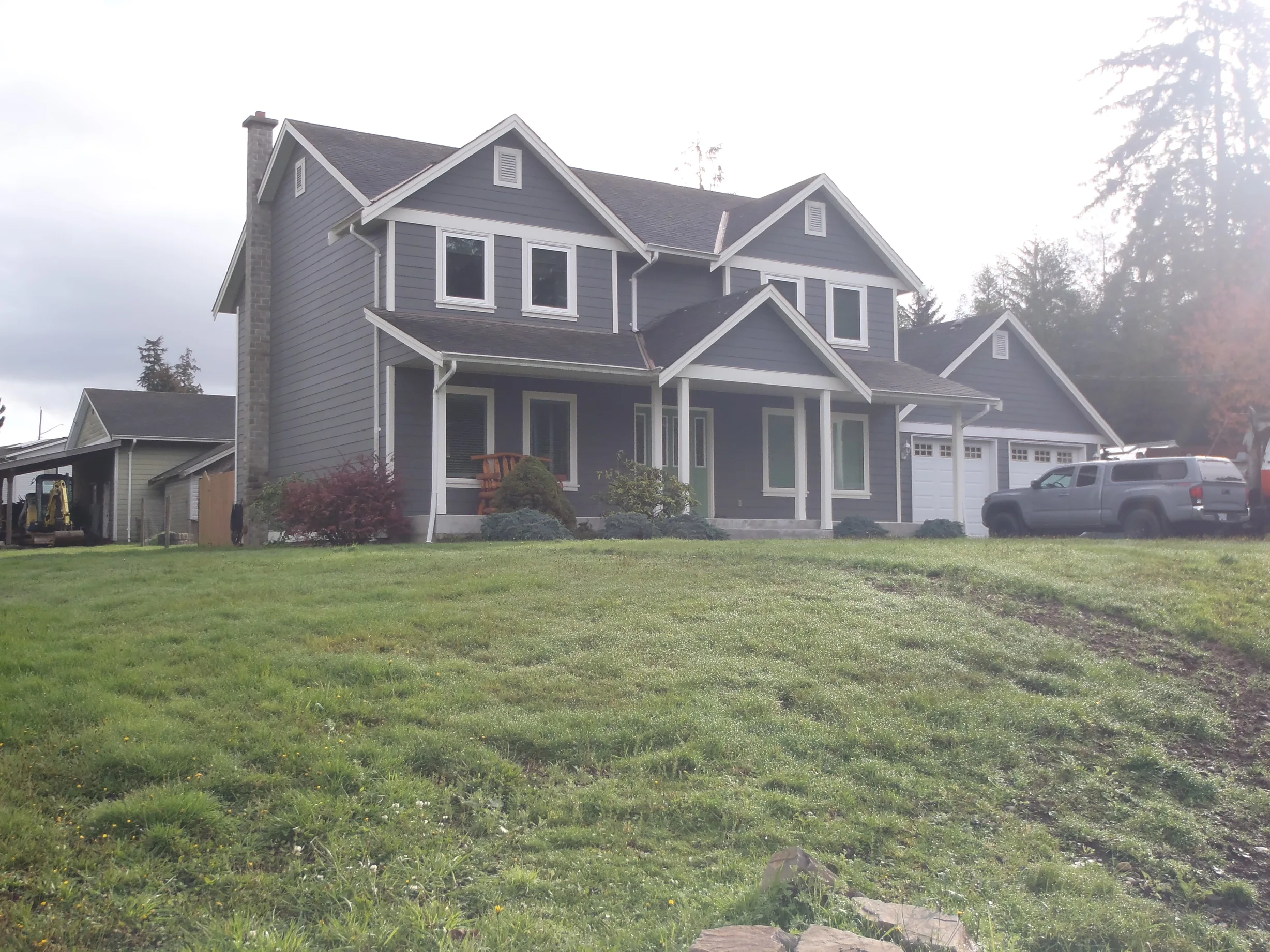 Before: a leaking asphalt shingle roof on the home, Sooke, British Columbia, ahead of a Black Interlock Slate aluminum roof