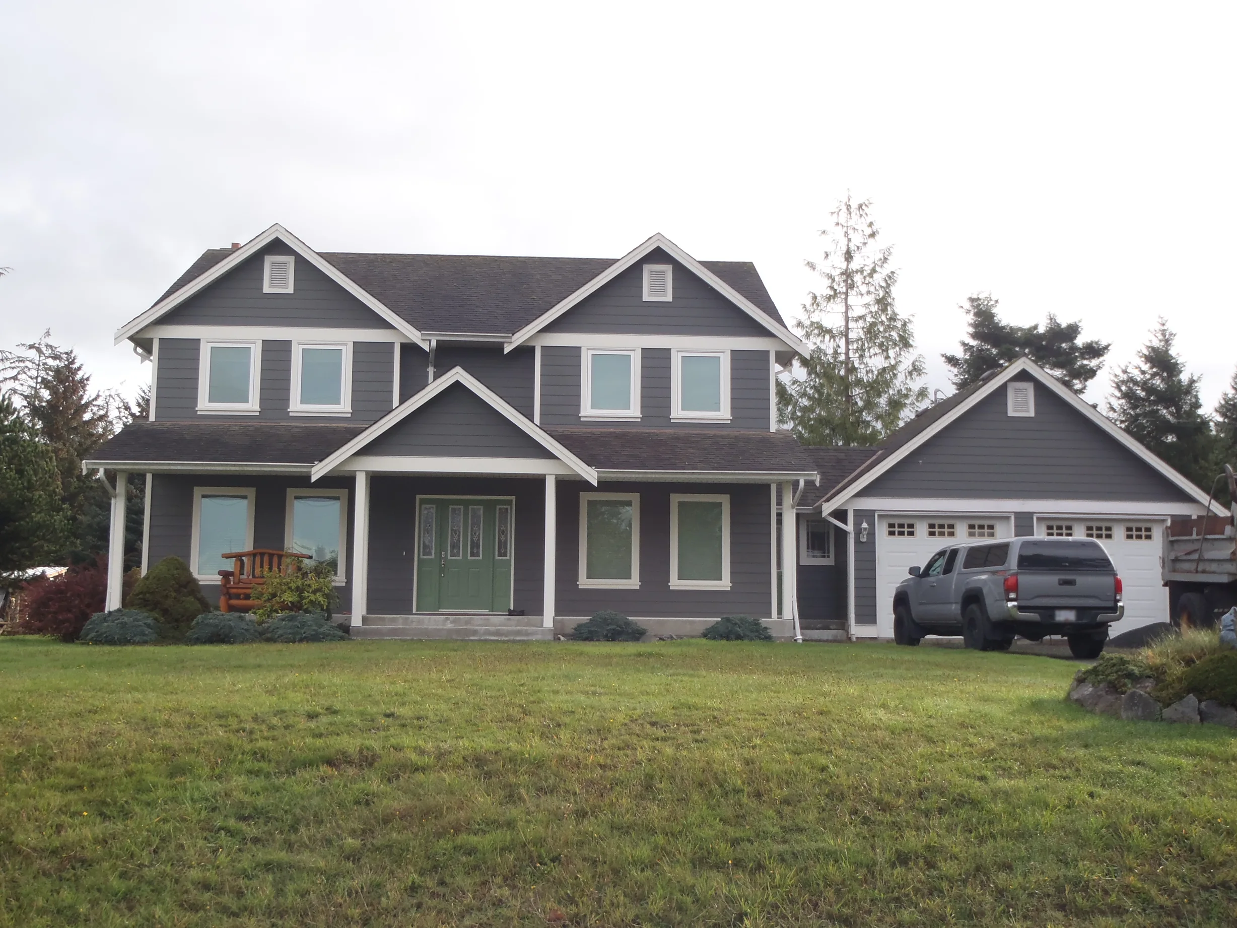 Before: a leaking asphalt shingle roof on the home, Sooke, British Columbia, ahead of a Black Interlock Slate aluminum roof
