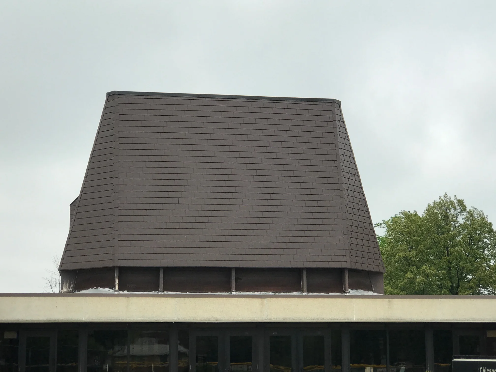 White Interlock IB Membrane aluminum roof on a beige home with a metal roof in a rural setting, Chicago Heights, Illinois