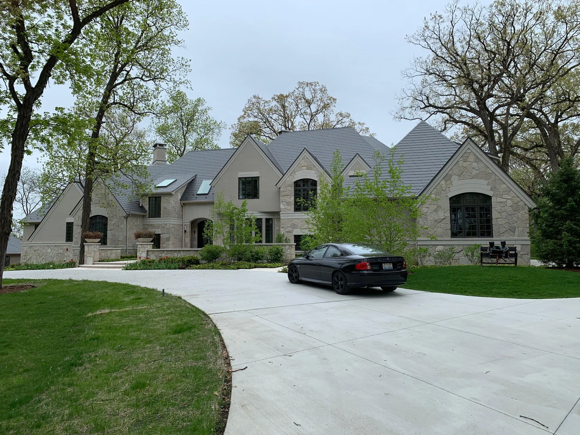 Musket Grey Interlock Slate aluminum roof being installed on the home, replacing an asphalt shingle roof being torn off, Long Grove, Illinois