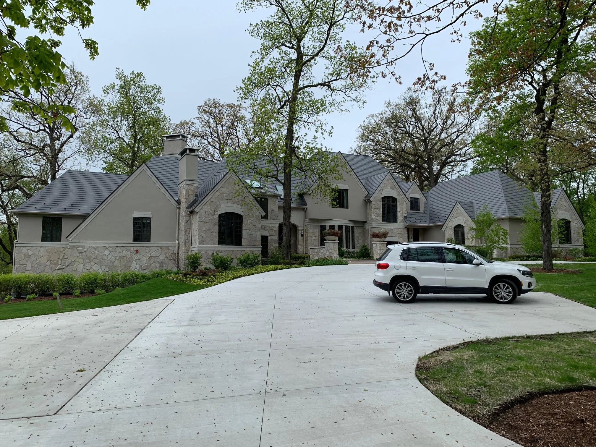 Musket Grey Interlock Slate aluminum roof on a colonial style home with a slate metal roof in a forested, Long Grove, Illinois