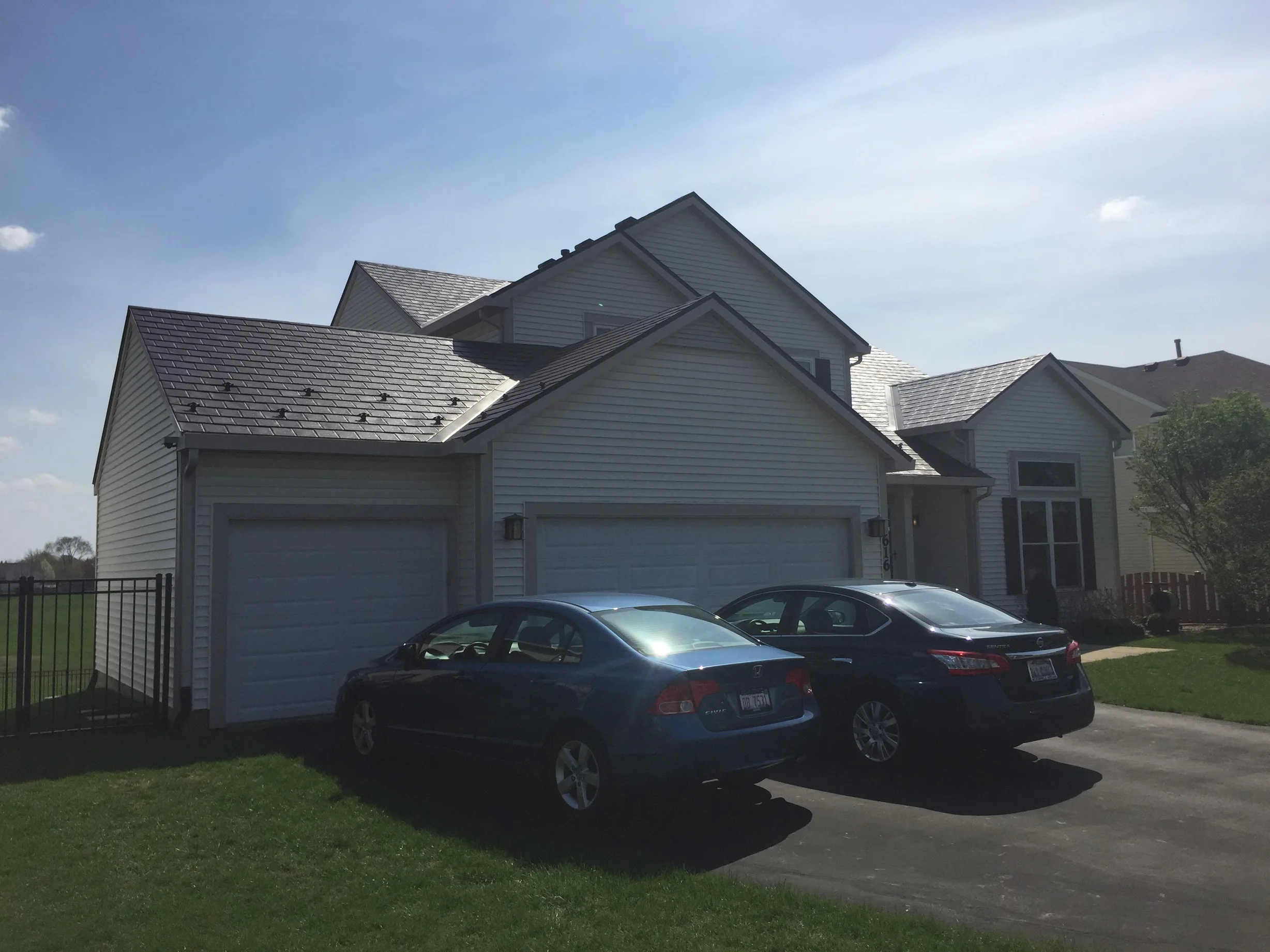 Colonial Brown Interlock Slate aluminum roof on a Colonial home with Colonial Brown metal roof in a, Carol Stream, Illinois