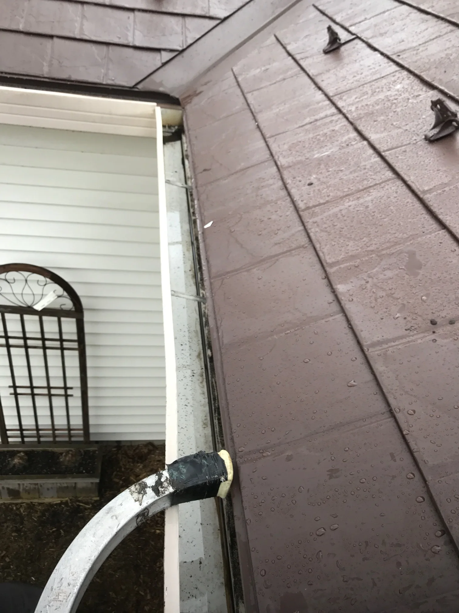 Colonial Brown Interlock Slate aluminum roof being installed on the home, replacing a worn out asphalt shingle roof, Carol Stream, Illinois