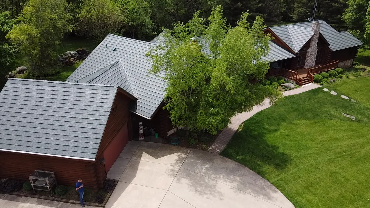 Hunter Green Interlock Shake aluminum roof on a brown house with a hunter green metal roof in a rural, Harvard, Illinois