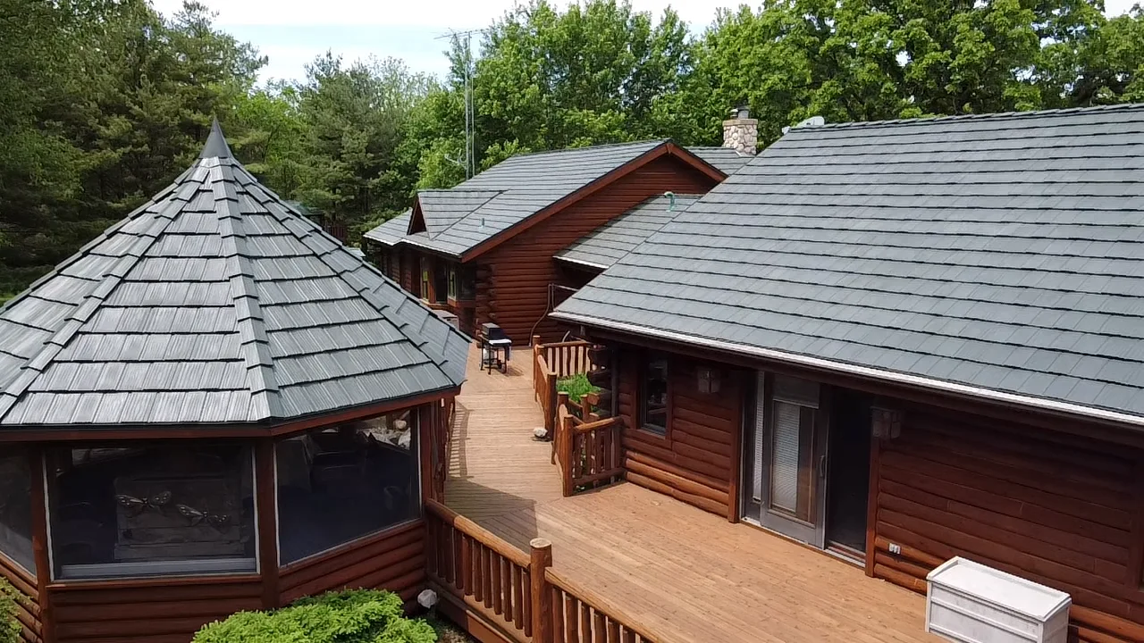 Hunter Green Interlock Shake aluminum roof on a brown ranch style home with a green metal roof in a, Harvard, Illinois