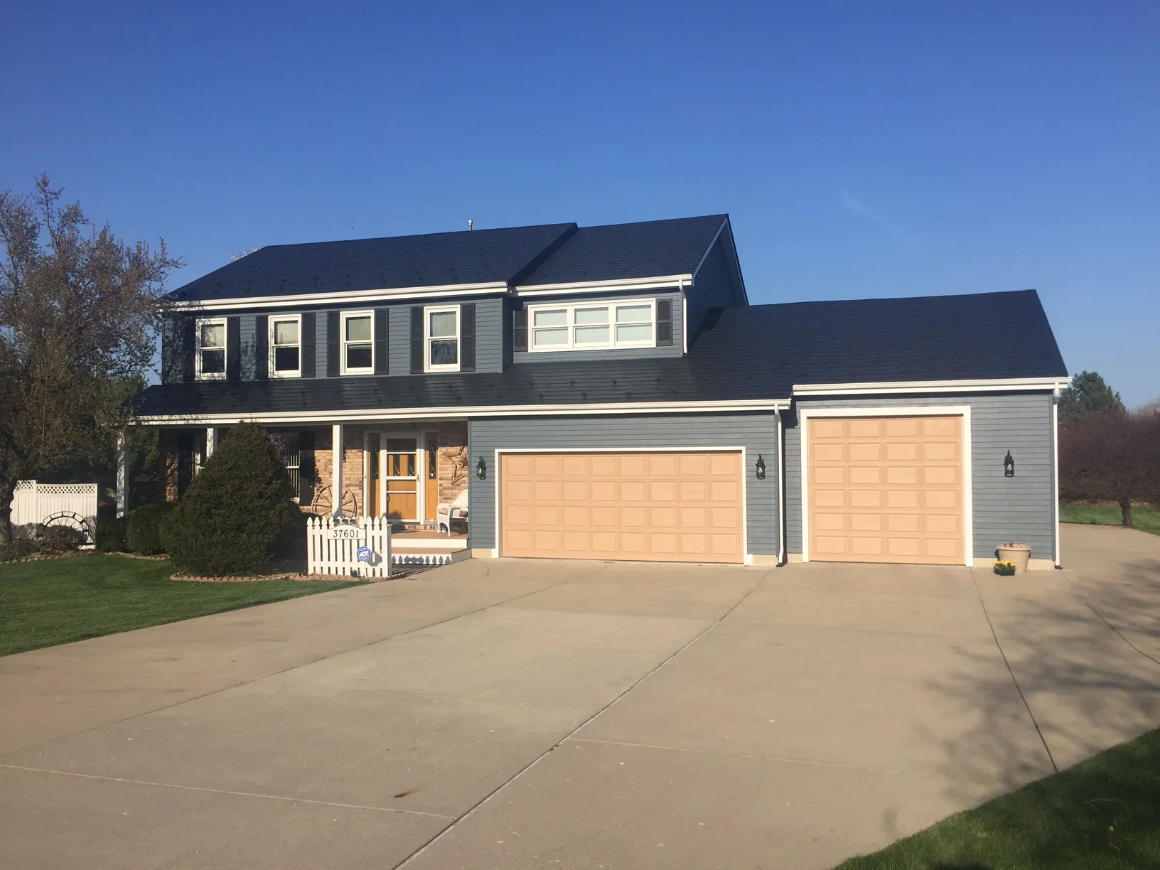 Black Interlock Slate aluminum roof on a two-storey Colonial home with dormers in a rural suburban, Wadsworth, Illinois