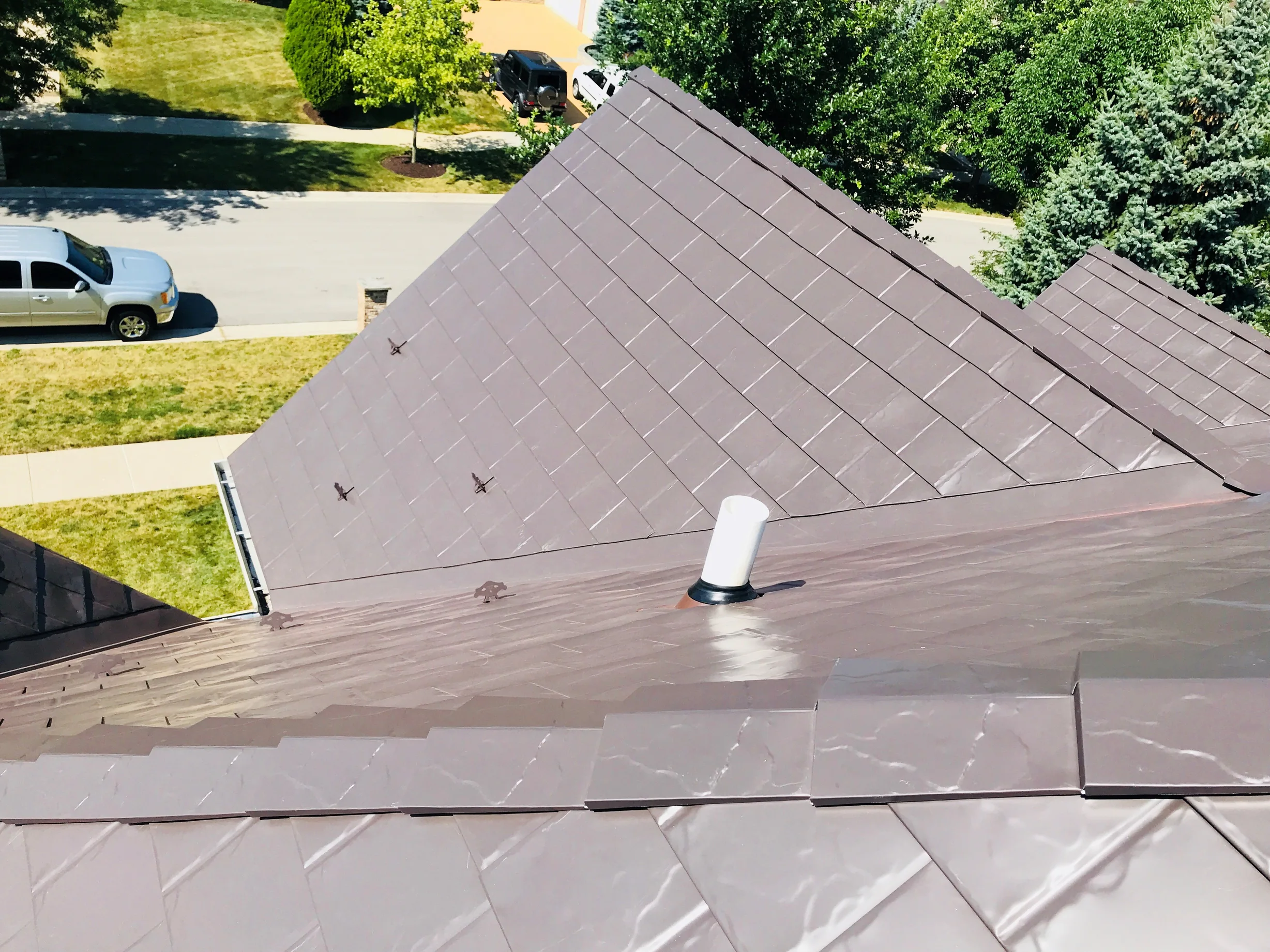 Tudor Brown Interlock Slate aluminum roof on a Tudor brown metal roof on a colonial home in a suburban, Roselle, Illinois
