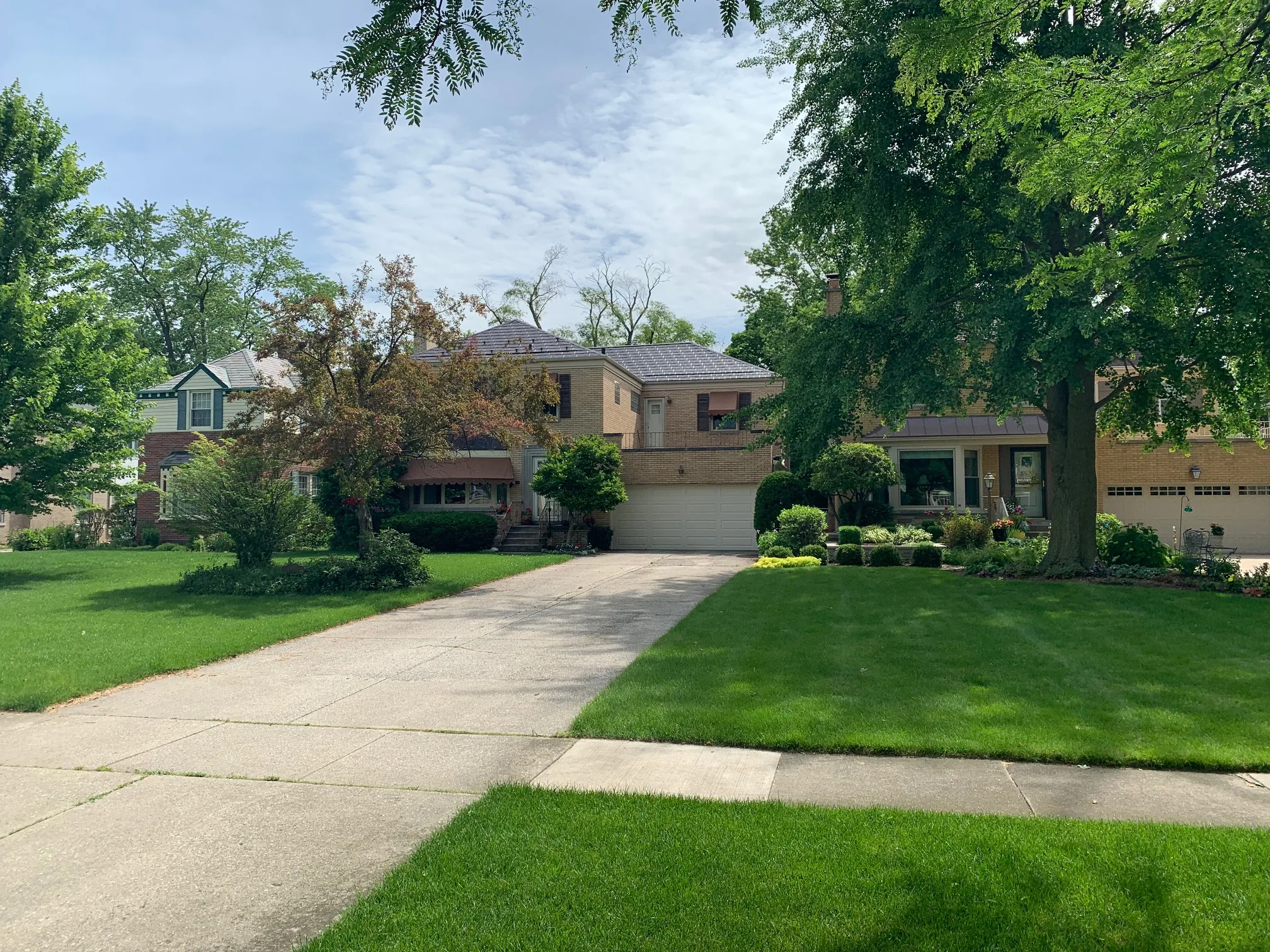 Colonial Brown Interlock Slate aluminum roof on a colonial home with a brown roof in a suburban forested, River Forest, Illinois