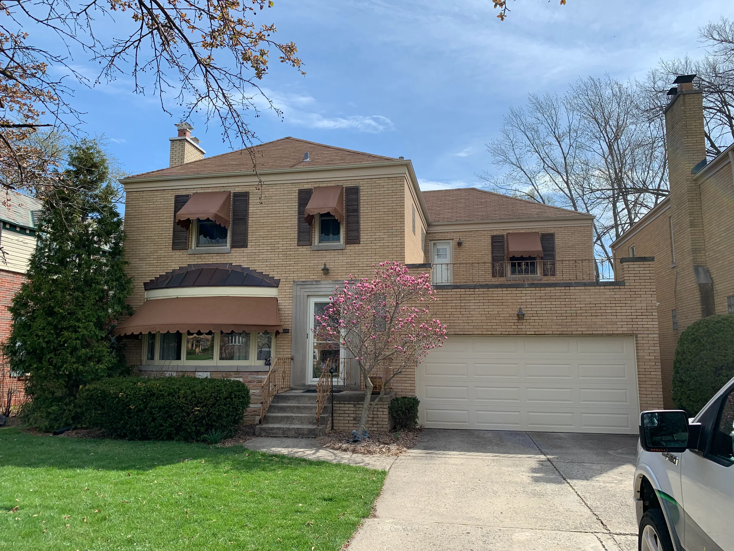 Before: a leaking asphalt shingle roof on the home, River Forest, Illinois, ahead of a Colonial Brown Interlock Slate aluminum roof