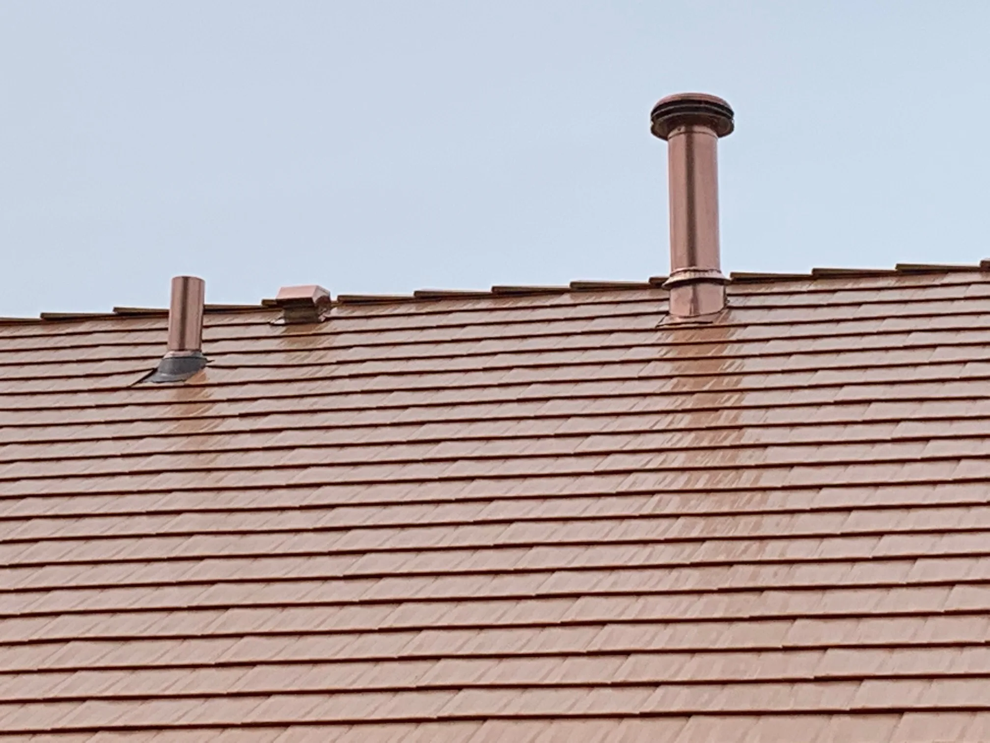 Copper Penny Interlock Cedar Shingle aluminum roof on a copper penny metal roof on a single-family home in a, Bolingbrook, Illinois