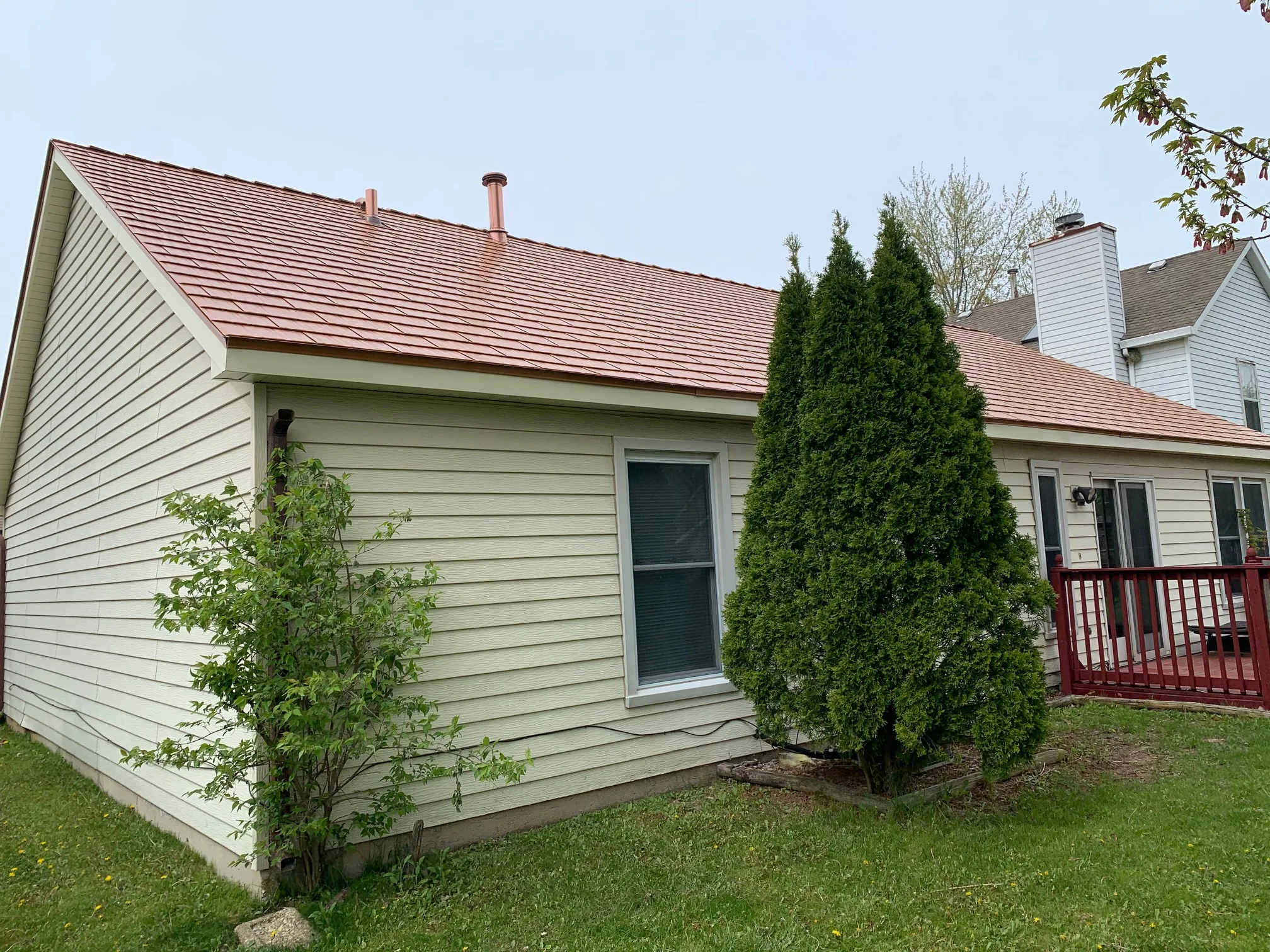 Copper Penny Interlock Cedar Shingle aluminum roof on a single-family home with a copper penny metal roof in a, Bolingbrook, Illinois