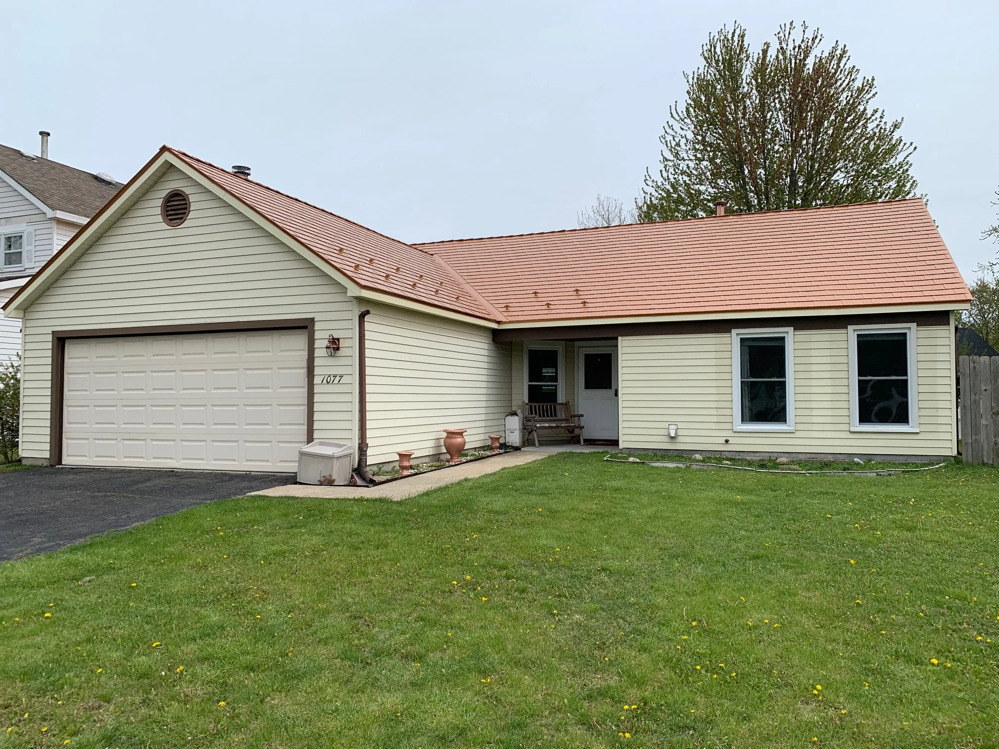 Copper Penny Interlock Cedar Shingle aluminum roof on a single-storey ranch home with a copper penny metal roof, Bolingbrook, Illinois