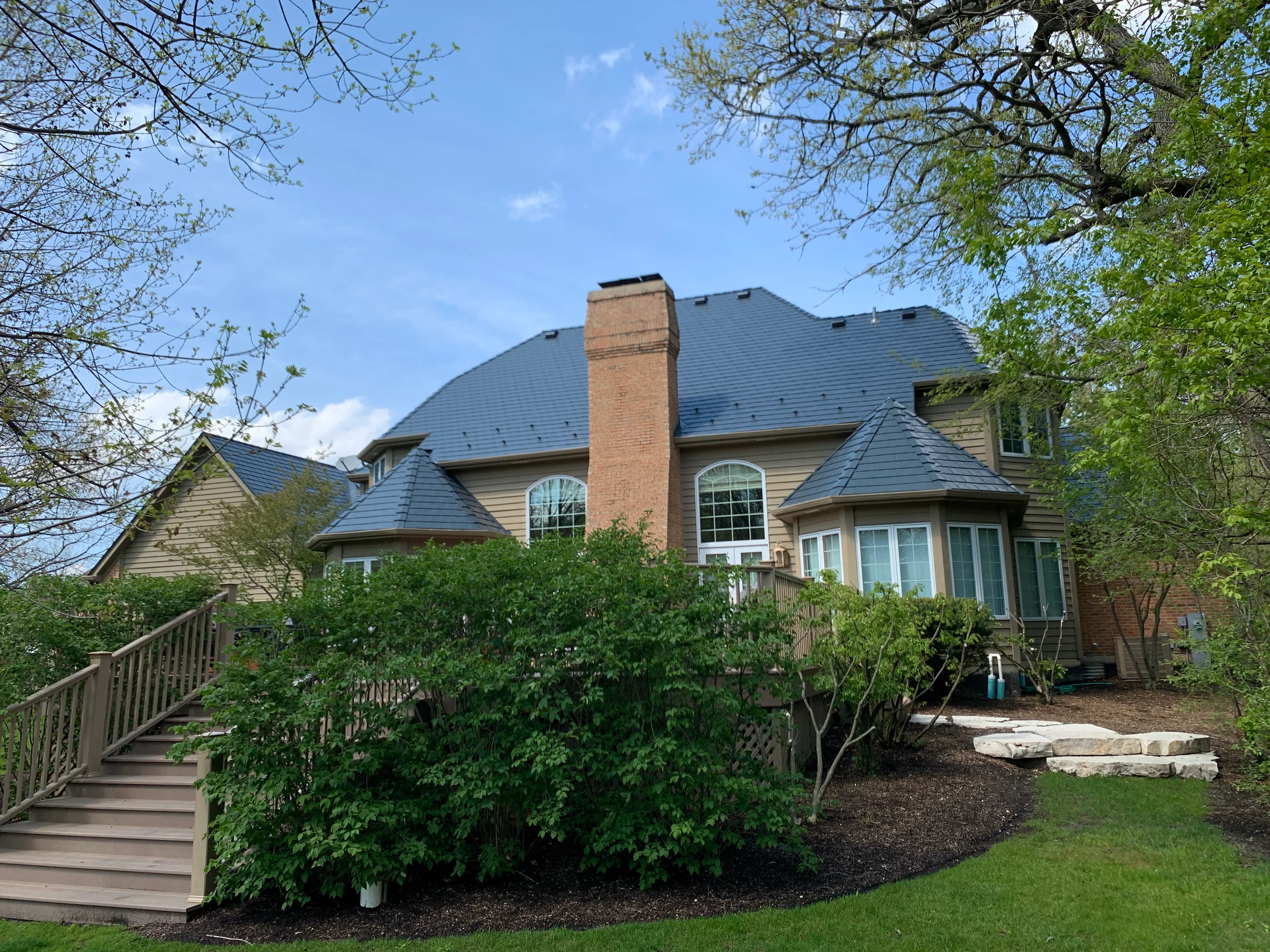 Deep Charcoal Interlock Slate aluminum roof on a two-storey home with a metal roof in Crystal Lake,, Crystal Lake, Illinois