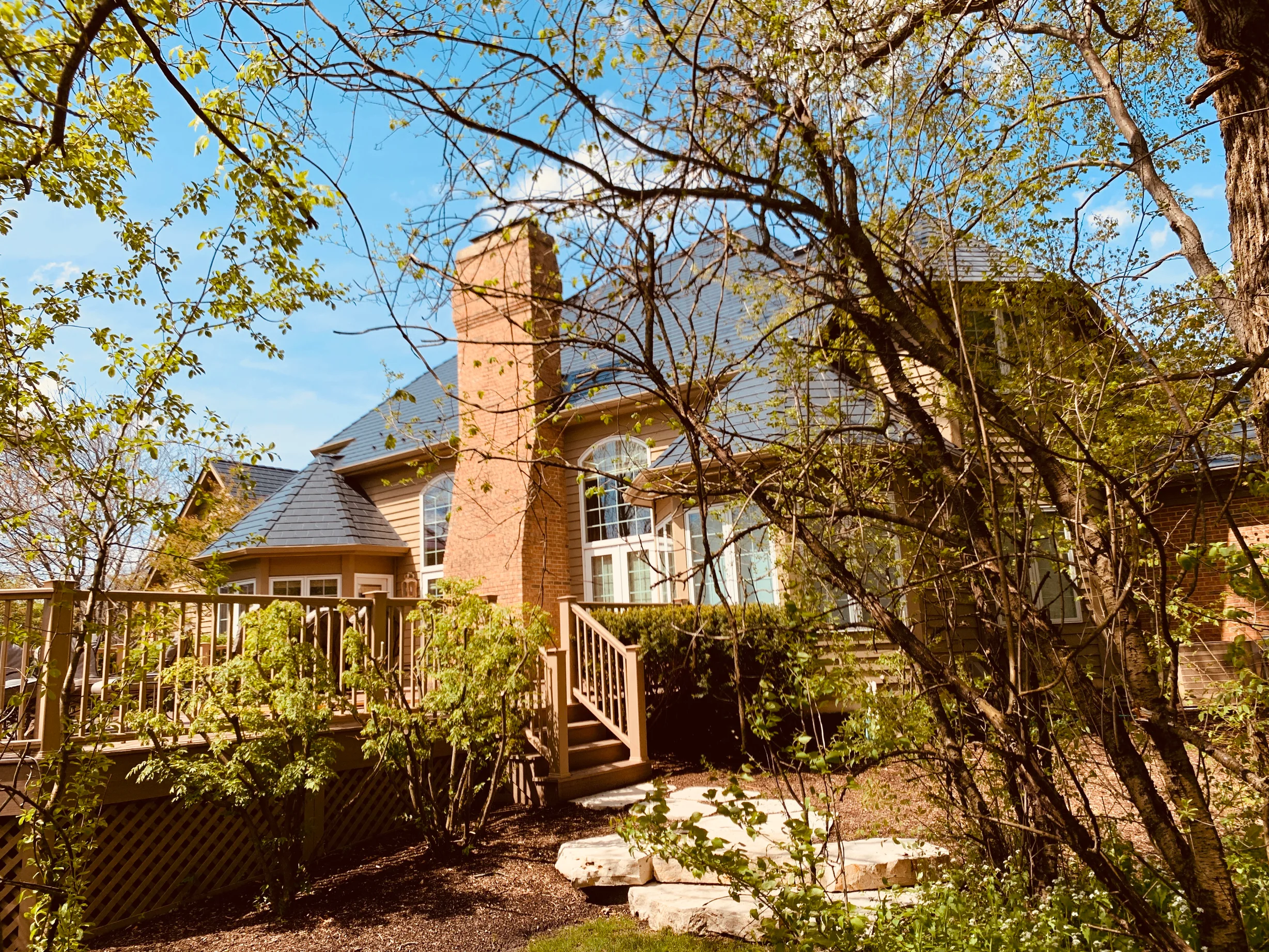 Deep Charcoal Interlock Slate aluminum roof on a single-family home in a suburban lakeside setting, Crystal Lake, Illinois