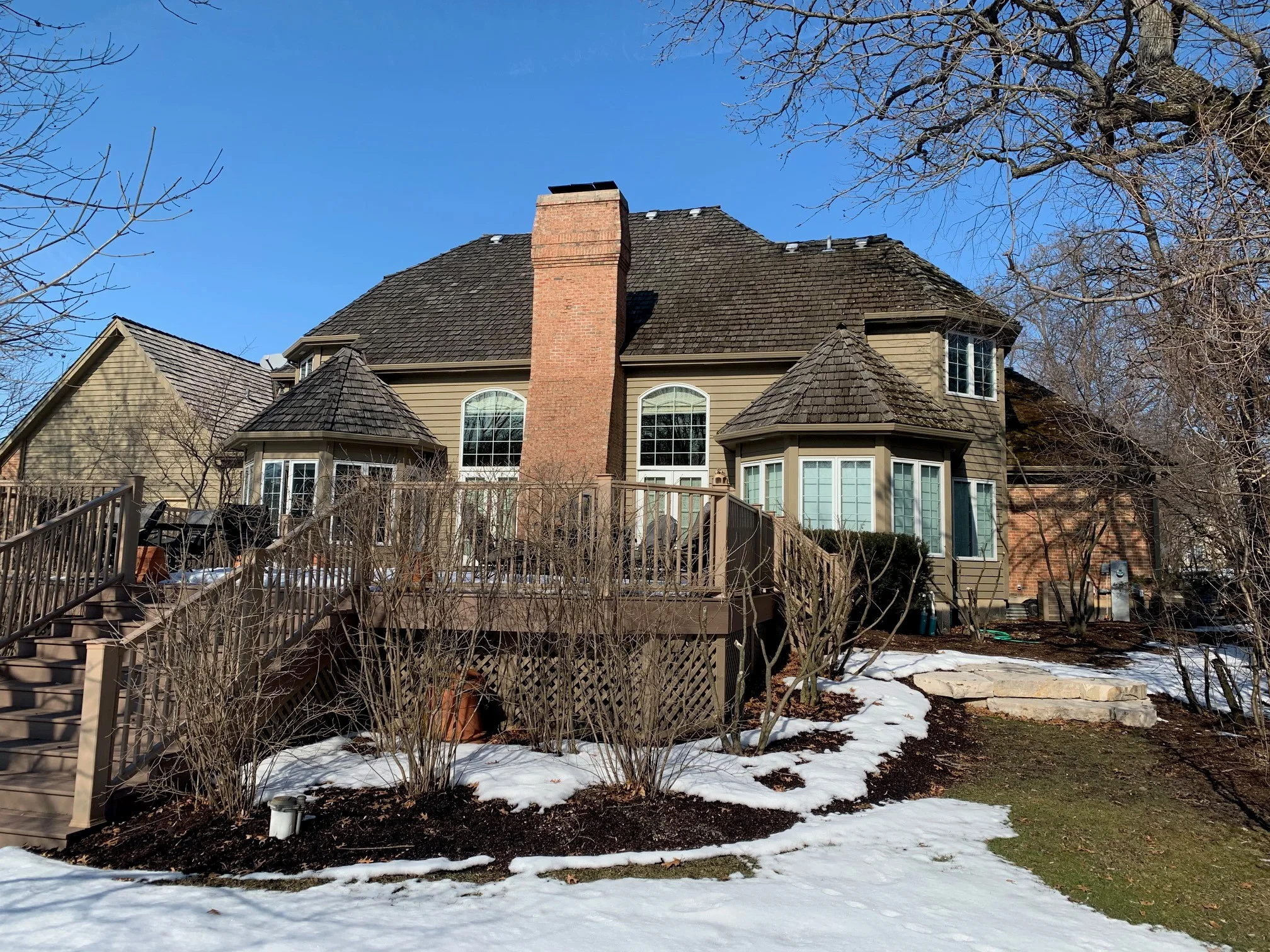 Before: a worn out wood shake roof on the home, Crystal Lake, Illinois, ahead of a Deep Charcoal Interlock Slate aluminum roof