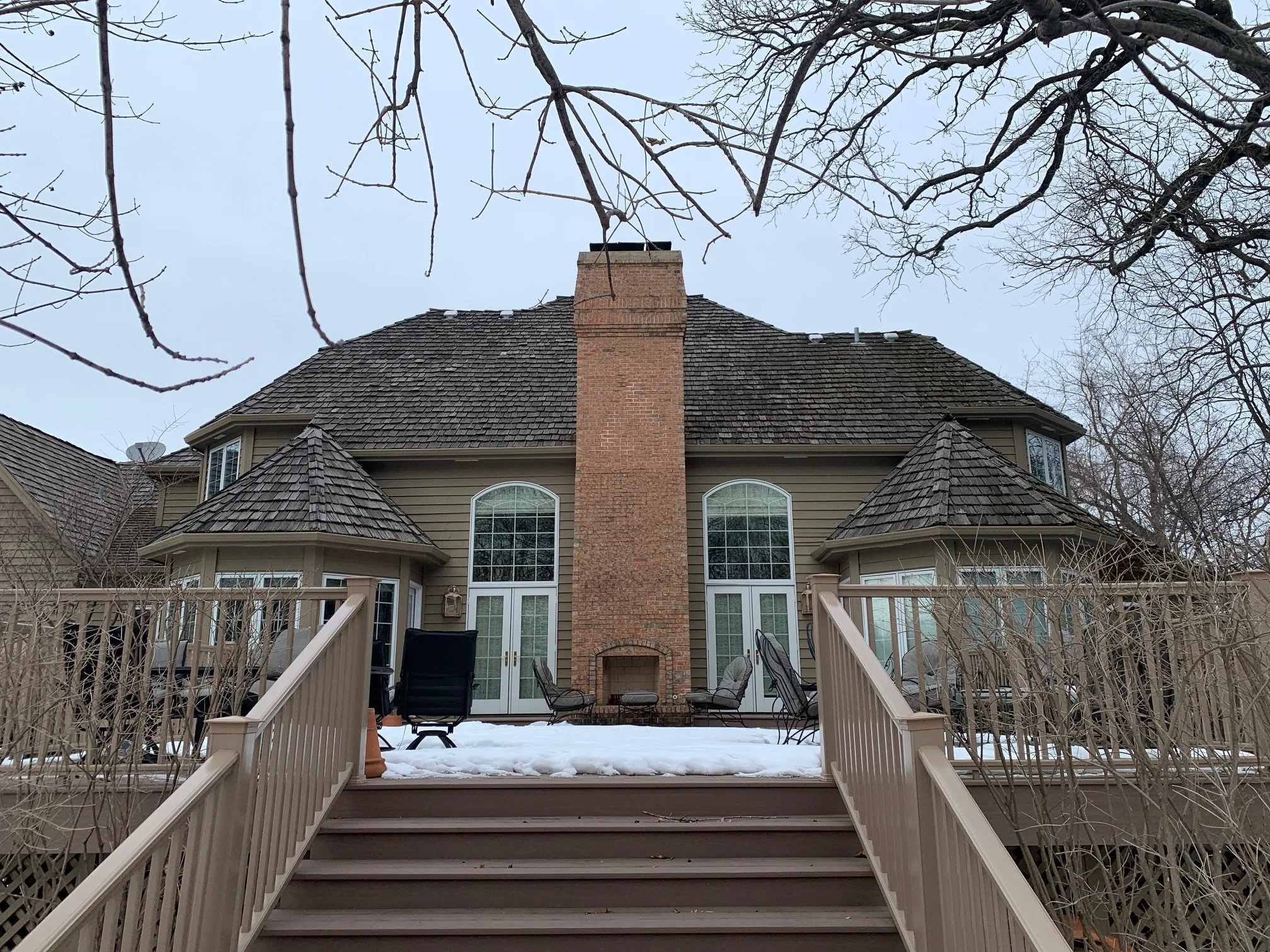 Before: a worn out wood shake roof on the home, Crystal Lake, Illinois, ahead of a Deep Charcoal Interlock Slate aluminum roof