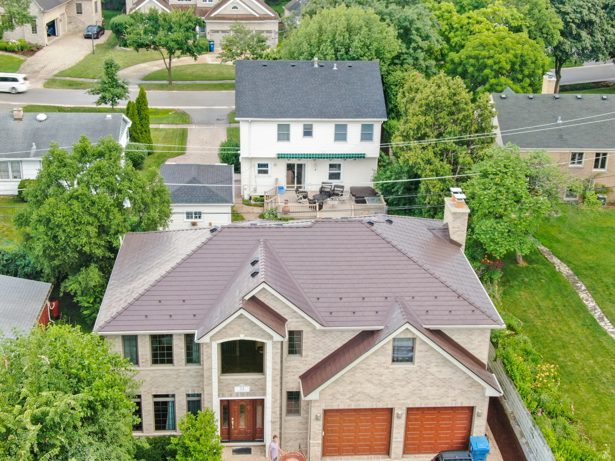 Colonial Brown Interlock Slate aluminum roof on a colonial home with a brown metal roof in a suburban area, Calredon Hills, Illinois