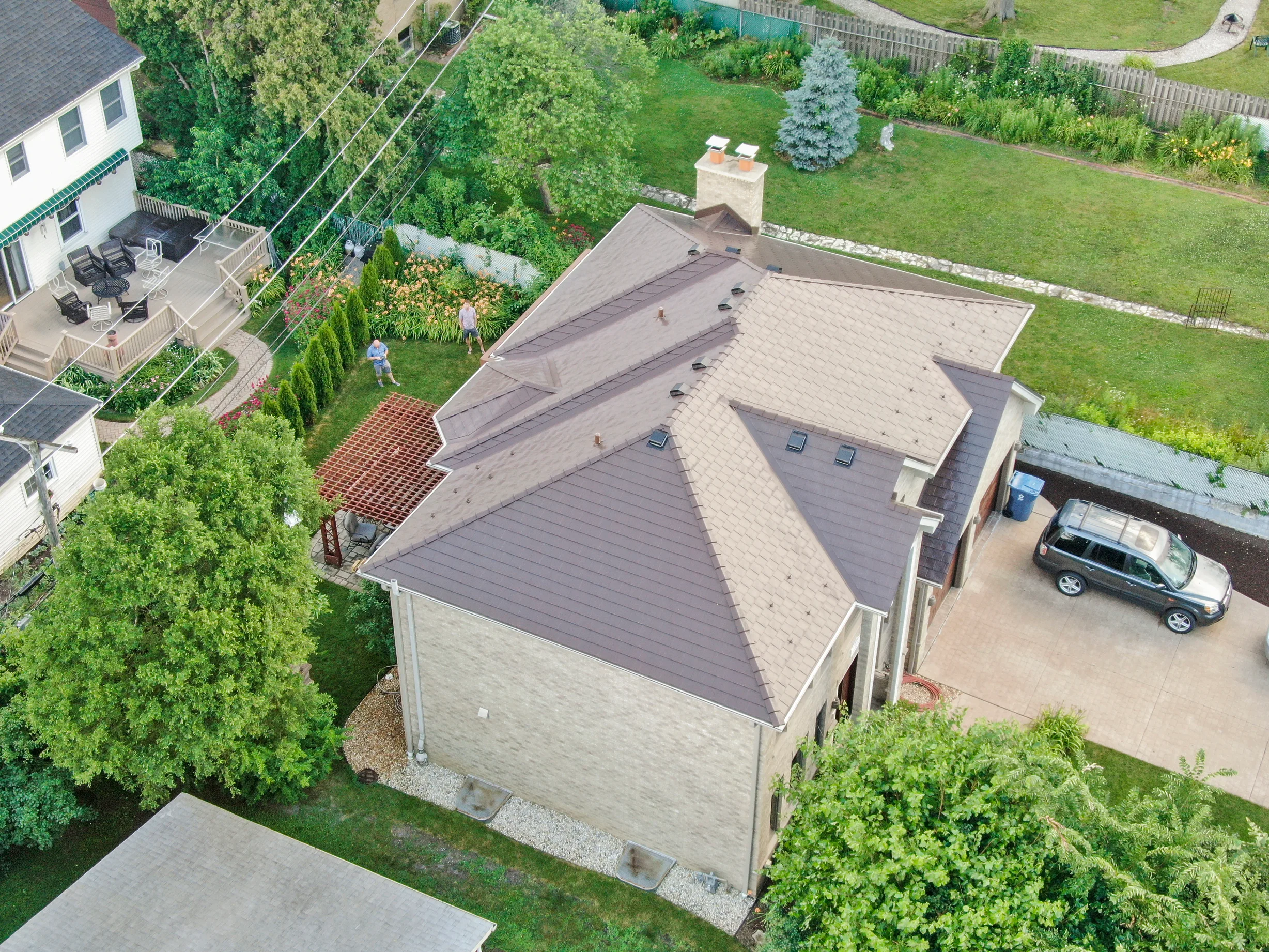 Colonial Brown Interlock Slate aluminum roof on a Colonial brown metal roof on a single-family home in a, Calredon Hills, Illinois